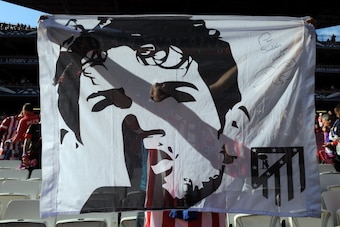LISBON, PORTUGAL - MAY 24: An Atletico de Madrid fan holds up a Diego Costa banner during the UEFA Champions League Final match between Real Madrid and Atletico de Madrid at Estadio da Luz on May 24, 2014 in Lisbon, Portugal. (Photo by Chris Brunskill Ltd