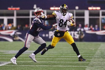 FOXBORO, MA - JANUARY 22:  Logan Ryan #26 of the New England Patriots attempts to tackle Antonio Brown #84 of the Pittsburgh Steelers in the AFC Championship Game at Gillette Stadium on January 22, 2017 in Foxboro, Massachusetts.  (Photo by Al Bello/Getty