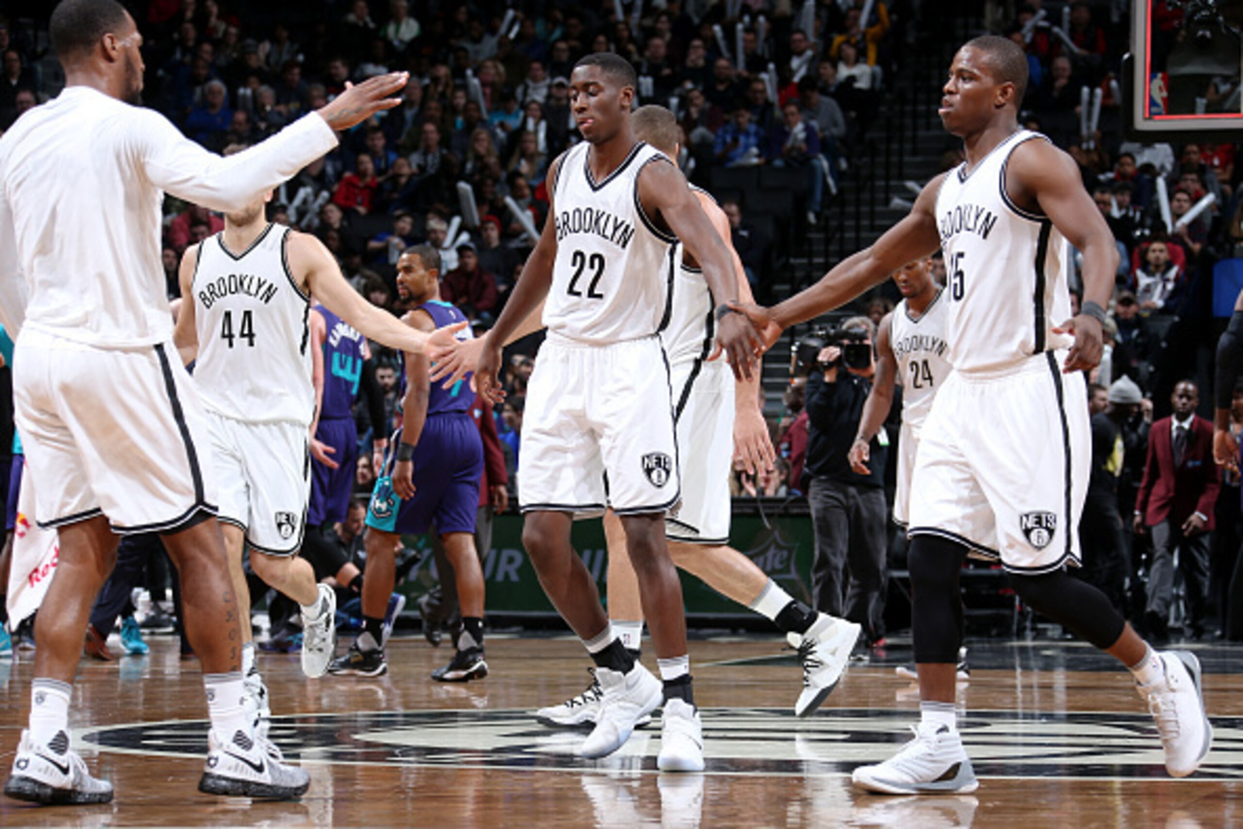 BROOKLYN, NY - December 26: Caris LeVert #22 of the Brooklyn Nets reacts with Isaiah Whitehead #15 of the Brooklyn Nets and Sean Kilpatrick #6 of the Brooklyn Nets during a game between the Charlotte Hornets and the Brooklyn Nets on December 26, 2016 at B