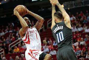 HOUSTON, TX - FEBRUARY 07: Trevor Ariza #1 of the Houston Rockets drives on Evan Fournier #10 of the Orlando Magic for a layup at Toyota Center on February 7, 2017 in Houston, Texas. NOTE TO USER: User expressly acknowledges and agrees that, by downloadi HOUSTON, TX - FEBRUARY 07: Trevor Ariza #1 of the Houston Rockets drives on Evan Fournier #10 of the Orlando Magic for a layup at Toyota Center on February 7, 2017 in Houston, Texas. NOTE TO USER: User expressly acknowledges and agrees that, by downloadi