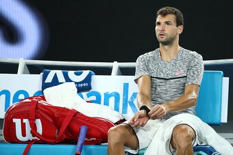 MELBOURNE, AUSTRALIA - JANUARY 27:  Grigor Dimitrov of Bulgaria looks on in his semifinal match against Rafael Nadal of Spain on day 12 of the 2017 Australian Open at Melbourne Park on January 27, 2017 in Melbourne, Australia.  (Photo by Cameron Spencer/G