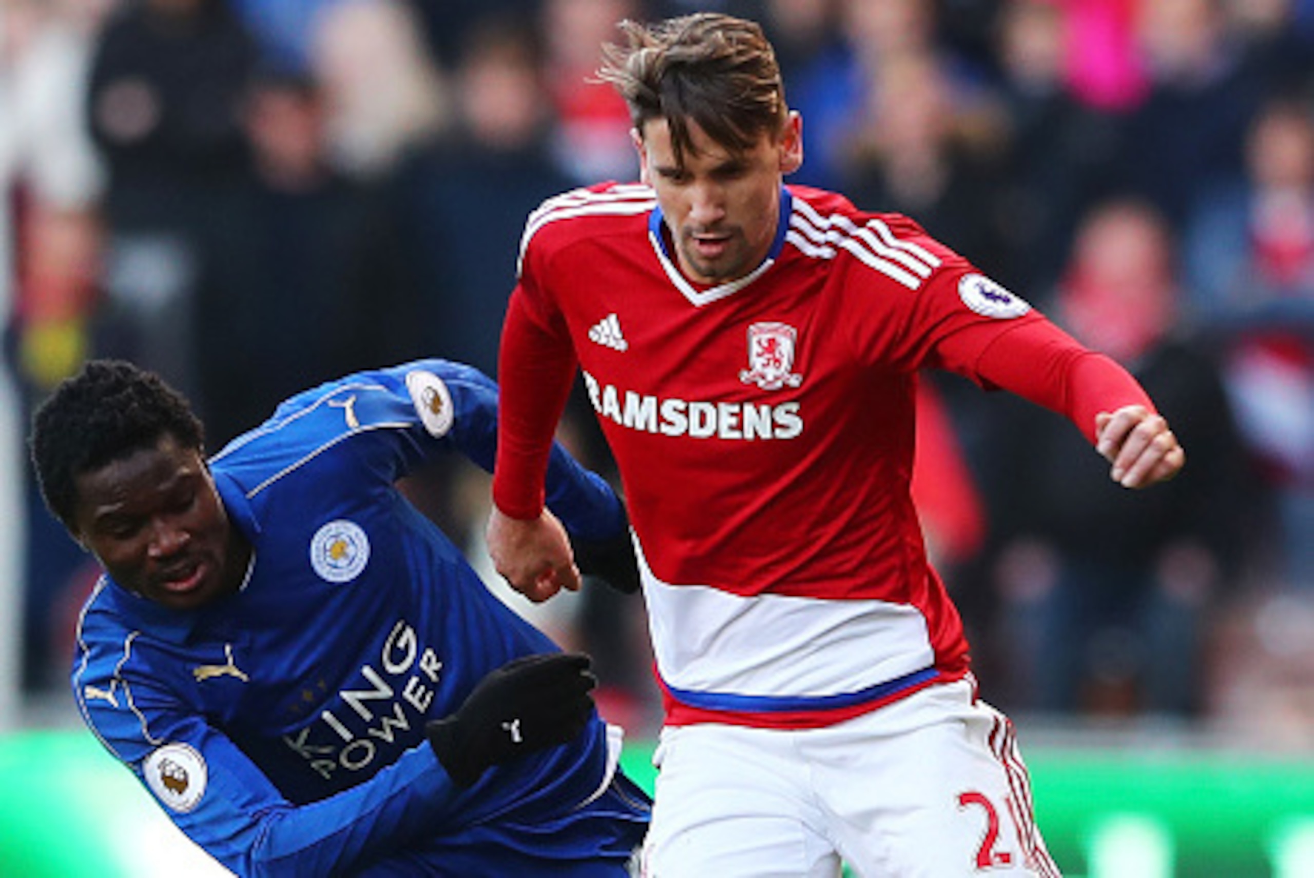 MIDDLESBROUGH, ENGLAND - JANUARY 02: Daniel Amartey of Leicester City (L) attempts to tackle Gaston Ramirez of Middlesbrough (R) during the Premier League match between Middlesbrough and Leicester City at Riverside Stadium on January 2, 2017 in Middlesbro