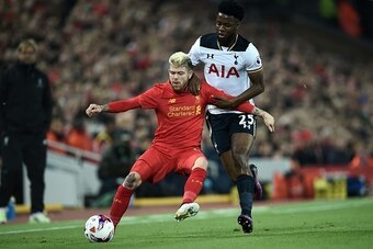 Liverpool's Spanish defender Alberto Moreno (L) vies with Tottenham Hotspur's English midfielder Joshua Onomah during the EFL (English Football League) Cup fourth round match between Liverpool and Tottenham Hotspur at Anfield in Liverpool north west Engla