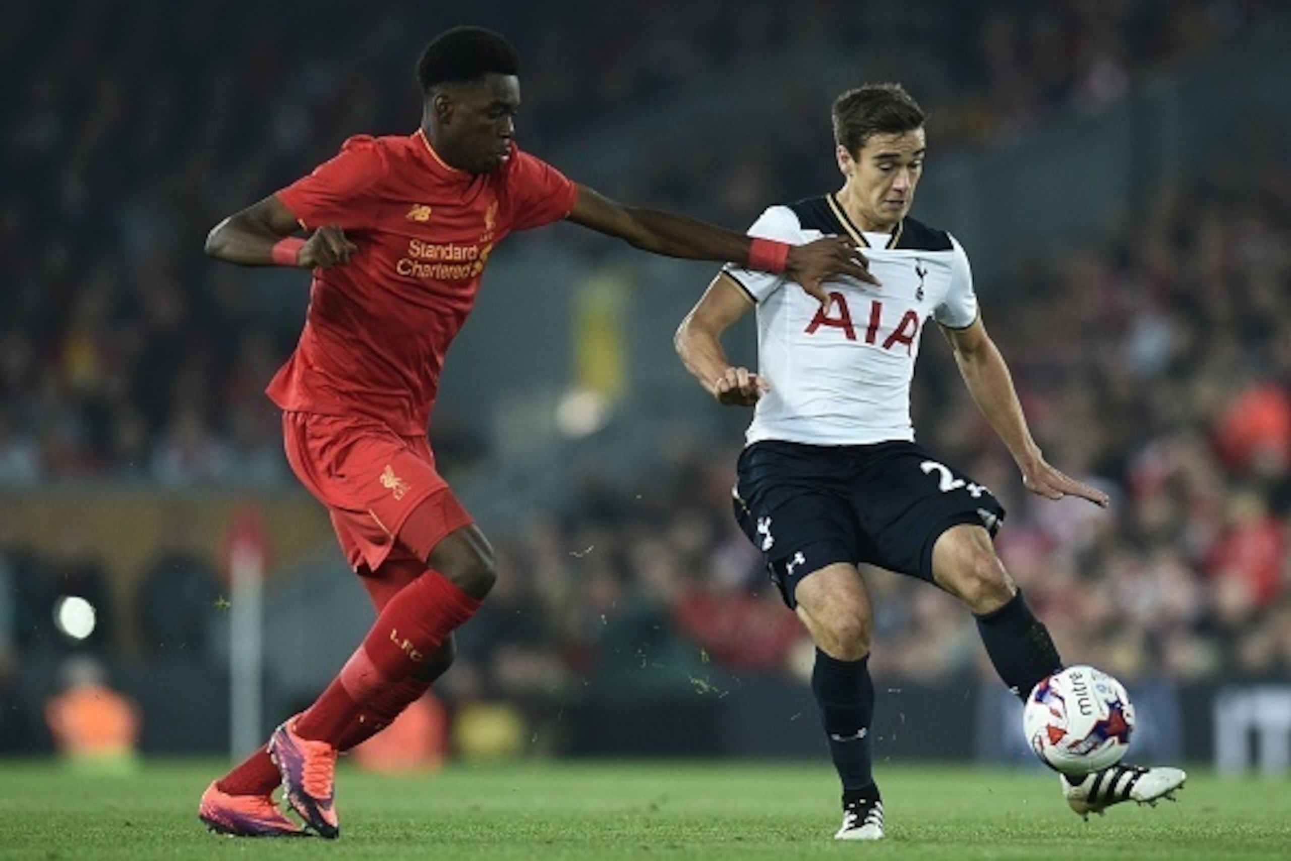 Tottenham Hotspur's English midfielder Harry Winks (R) vies with Liverpool's English midfielder Ovie Ejaria during the EFL (English Football League) Cup fourth round match between Liverpool and Tottenham Hotspur at Anfield in Liverpool north west England 
