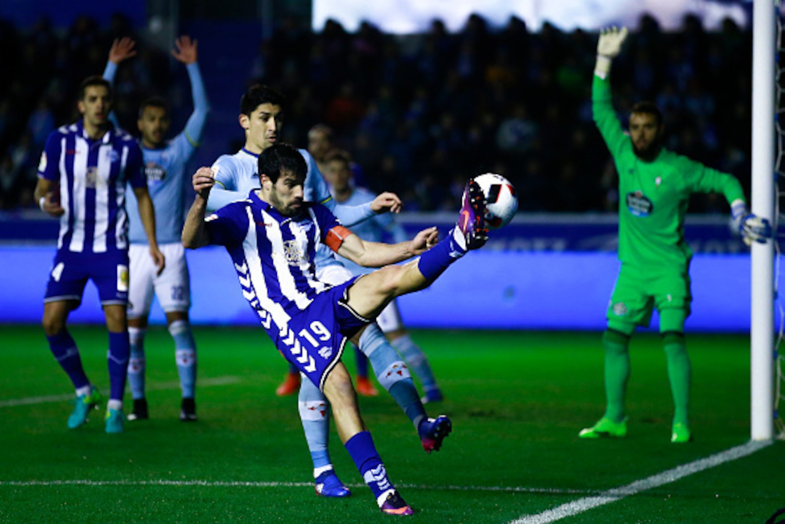 VITORIA-GASTEIZ, SPAIN - FEBRUARY 08:  Manuel Garcia Sanchez (L) of Deportivo Alaves competes for the ball with Pablo Hernandez (R) of RC Celta de Vigo  the Copa del Rey semi-final second leg match between Deportivo Alaves and RC Celta de Vigo at Estadio 