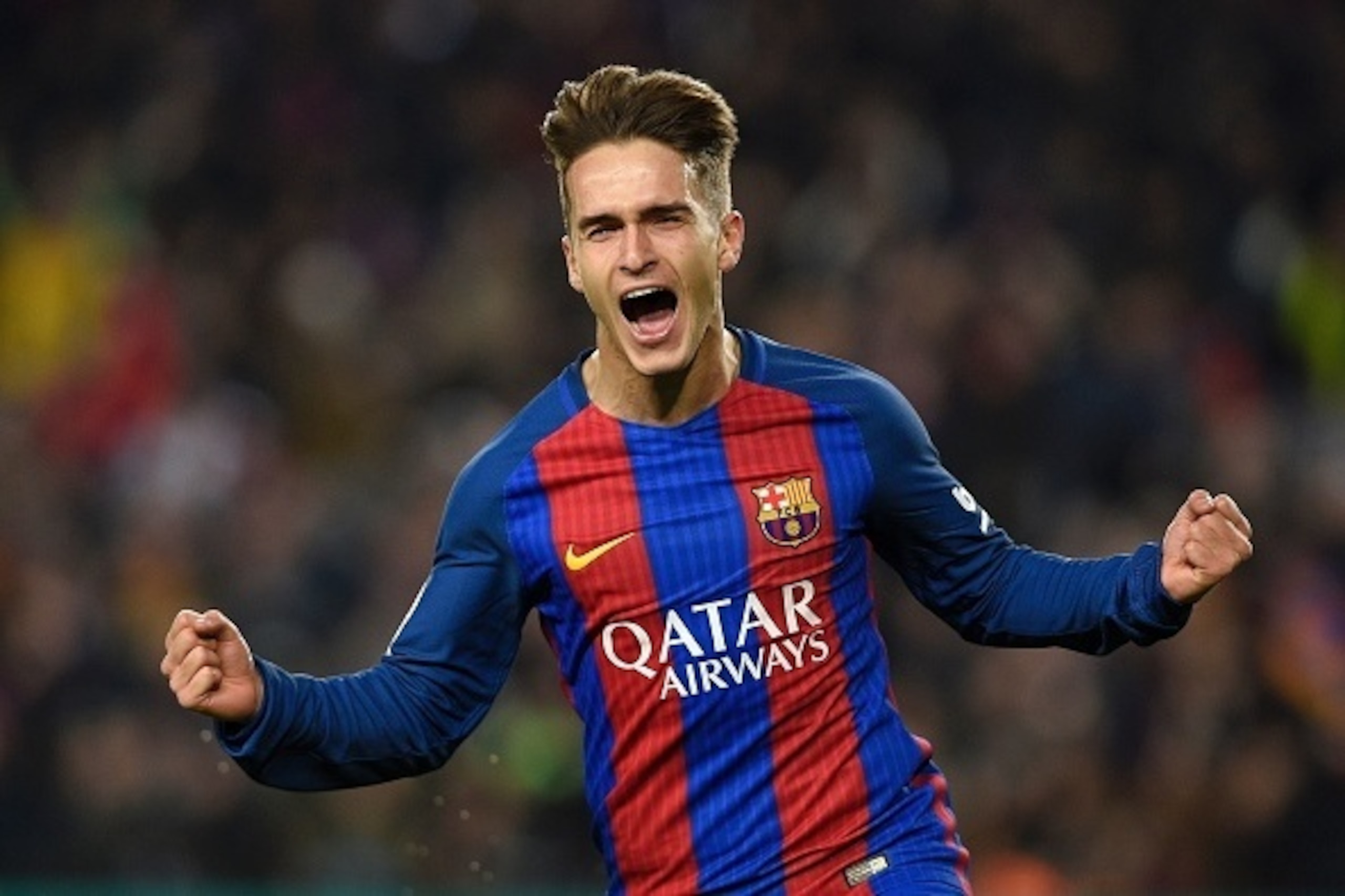 Barcelona's midfielder Denis Suarez celebrates after scoring the opener during the Spanish Copa del Rey (King's Cup) quarter final second leg football match FC Barcelona vs Real Sociedad at the Camp Nou stadium in Barcelona on January 26, 2017. / AFP / LL
