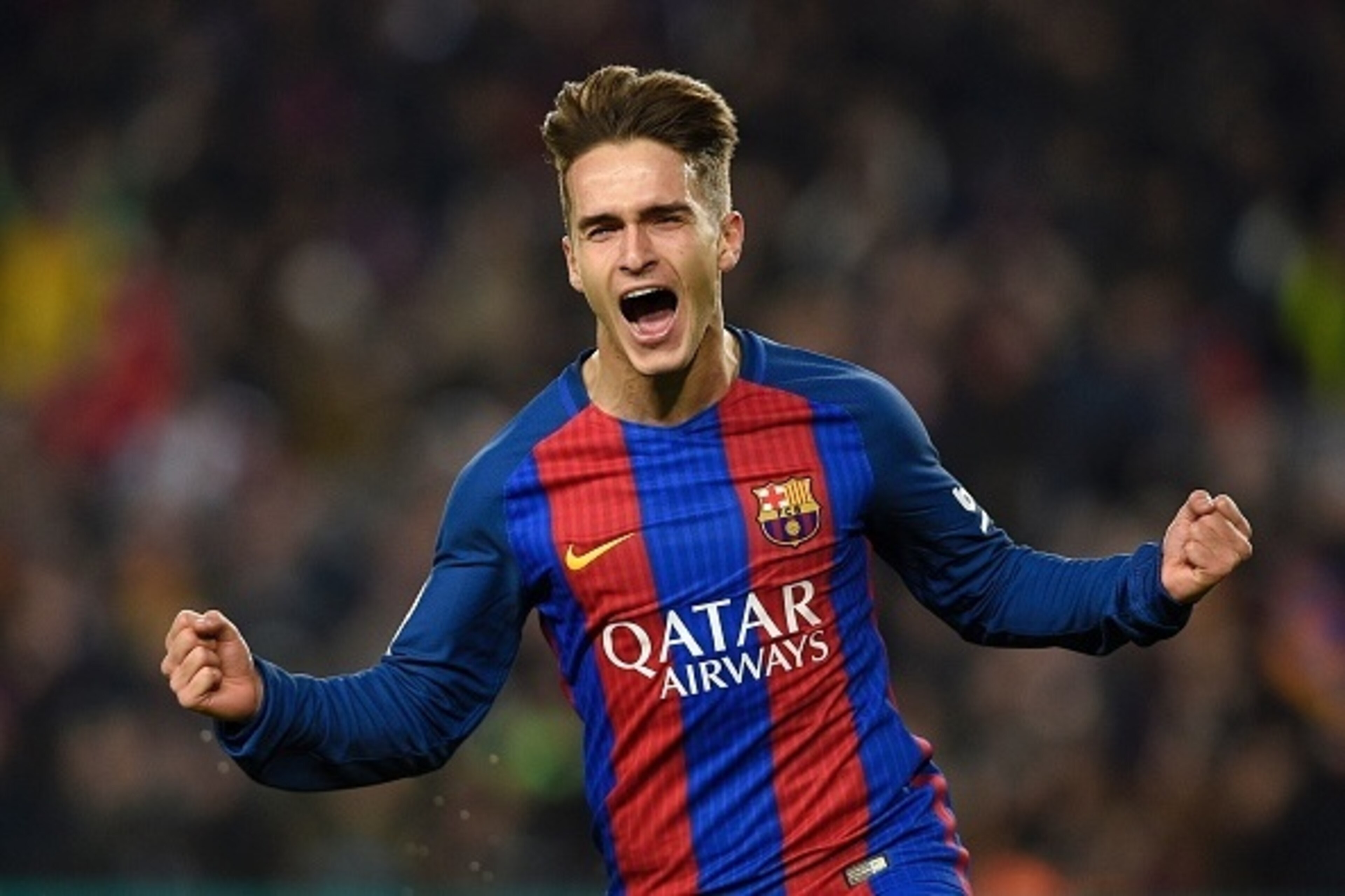 Barcelona's midfielder Denis Suarez celebrates after scoring the opener during the Spanish Copa del Rey (King's Cup) quarter final second leg football match FC Barcelona vs Real Sociedad at the Camp Nou stadium in Barcelona on January 26, 2017. / AFP / LL