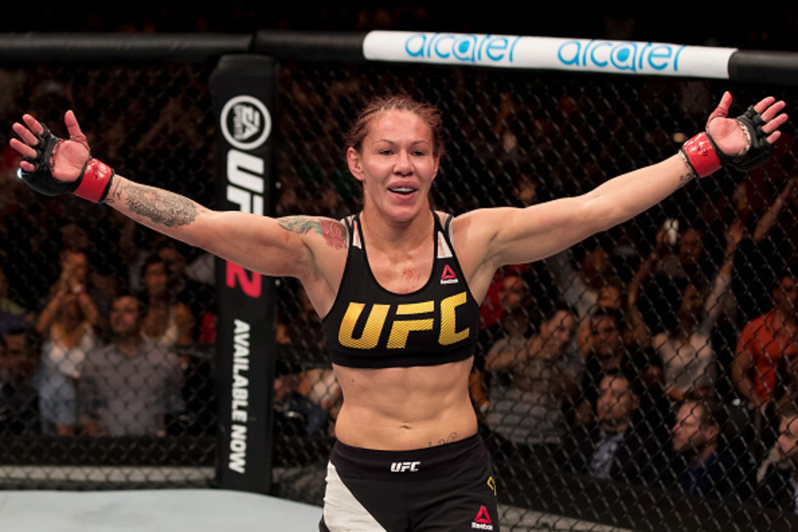 BRASILIA, BRAZIL - SEPTEMBER 24: Cris Cyborg of Brazil celebrates victory over Lina Lansberg of Sweden in their catchweight UFC bout during the UFC Fight Night event at Nilson Nelson gymnasium on September 24, 2016 in Brasilia, Brazil. (Photo by Buda Mend