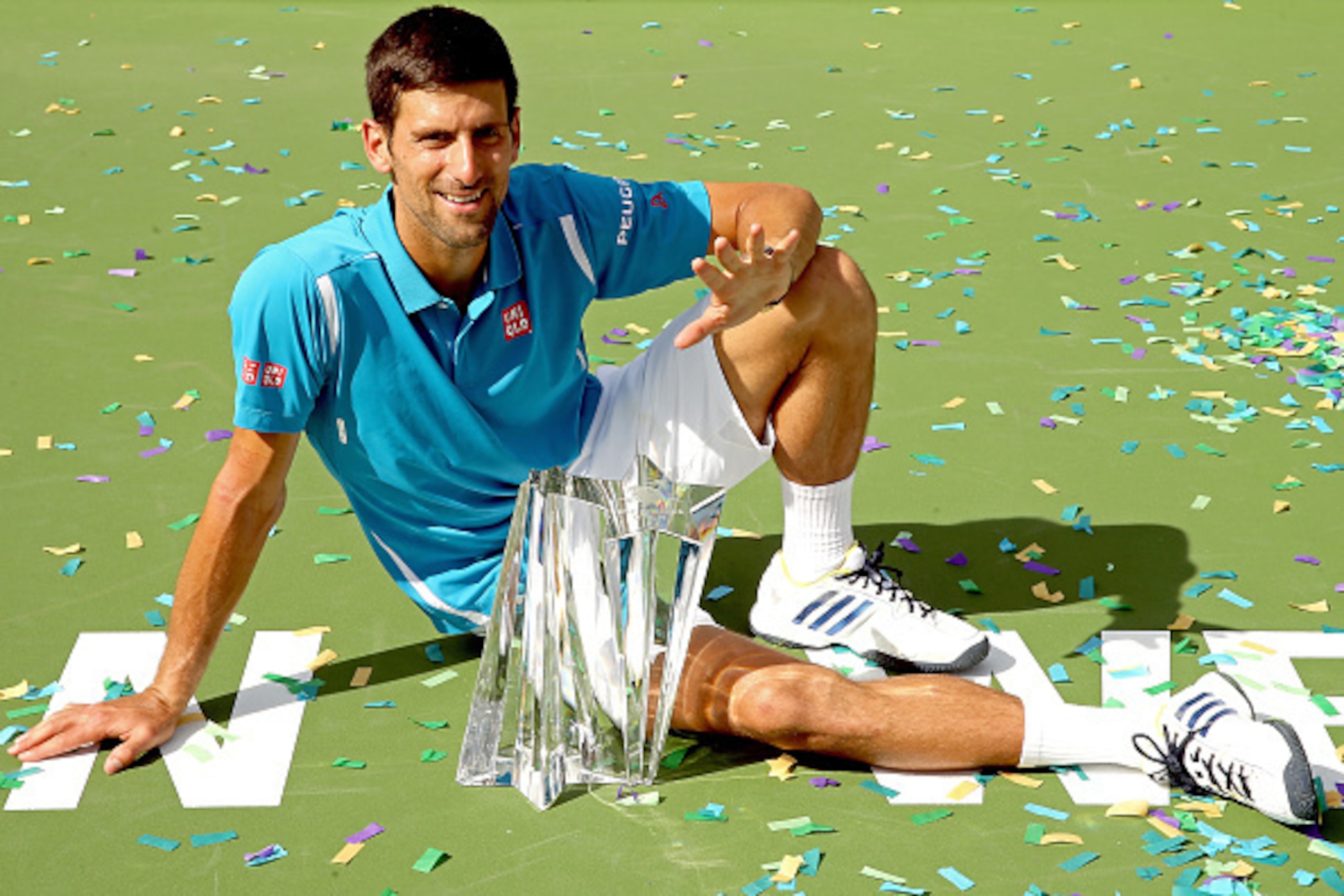 INDIAN WELLS, CA - MARCH 20: Novak Djokovic of Serbia poses with the winner's trophy after defeating Milos Raonic of Canada during the mens final of the BNP Paribas Open at the Indian Wells Tennis Garden on March 20, 2016 in Indian Wells, California. ( INDIAN WELLS, CA - MARCH 20: Novak Djokovic of Serbia poses with the winner's trophy after defeating Milos Raonic of Canada during the mens final of the BNP Paribas Open at the Indian Wells Tennis Garden on March 20, 2016 in Indian Wells, California. (