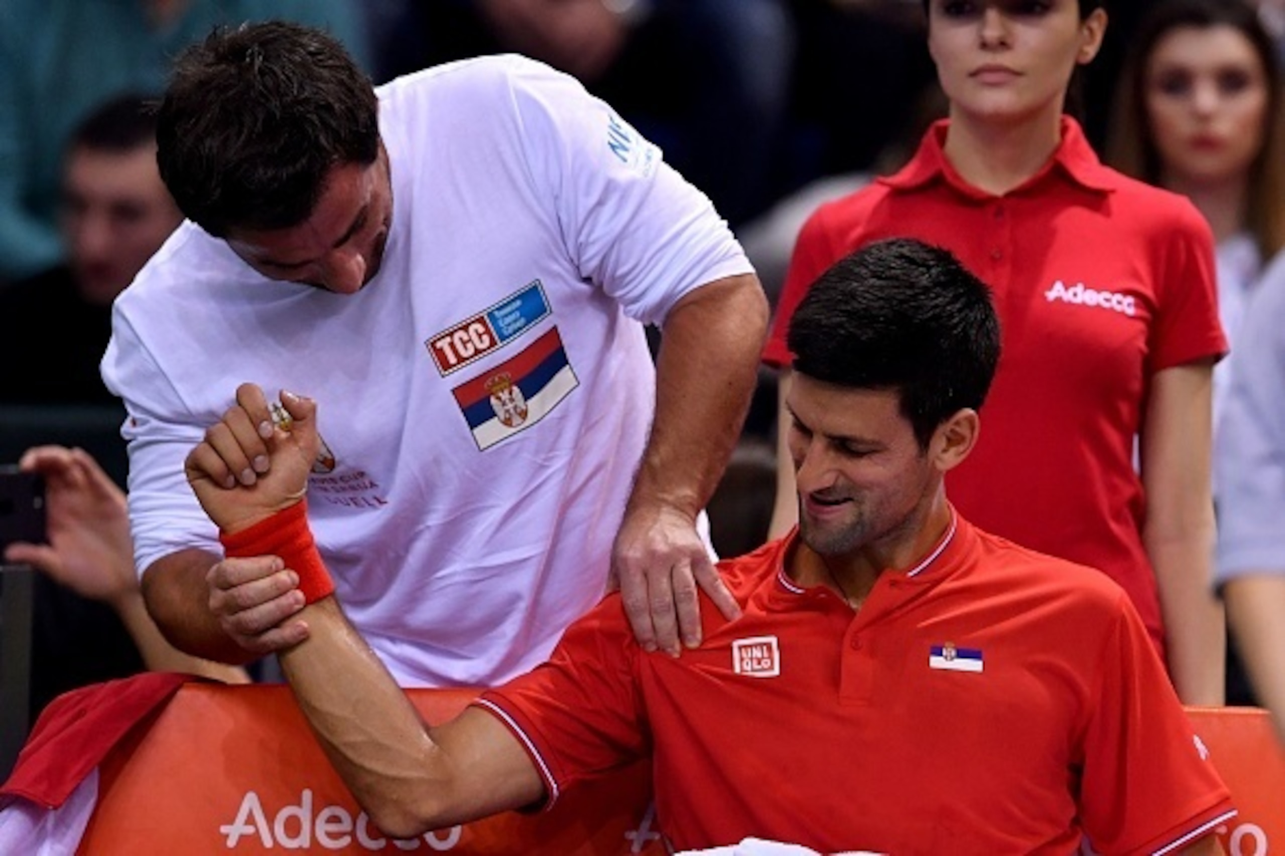 Serbia's Novak Djokovic receives medical treatment during the Davis Cup World Group first round singles tennis match between Serbia and Russia at Cair sports hall in Nis, on February 3, 2017. / AFP / ANDREJ ISAKOVIC (Photo credit should read ANDREJ Serbia's Novak Djokovic receives medical treatment during the Davis Cup World Group first round singles tennis match between Serbia and Russia at Cair sports hall in Nis, on February 3, 2017. / AFP / ANDREJ ISAKOVIC (Photo credit should read ANDREJ