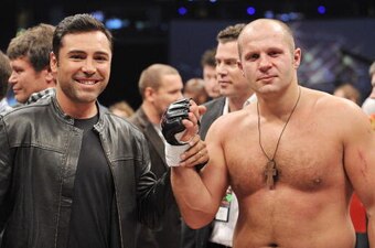 ANAHEIM, CA - JANUARY 24:  Golden Boy Promoter/boxer Oscar De La Hoya (L) and Affliction Fedor Emelianenko pose after Fedor defeated Andrei Arlovski in the first round during their Heavyweight bout at 'Affliction M-1 Global Day of Reckoning' at the Honda 
