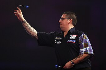 LONDON, ENGLAND - JANUARY 02:  Gary Anderson of Great Britain throws Michael van Gerwen of The Netherlands during the final of the 2017 William Hill PDC World Darts Championships at Alexandra Palace on January 2, 2017 in London, England.  (Photo by Bryn L