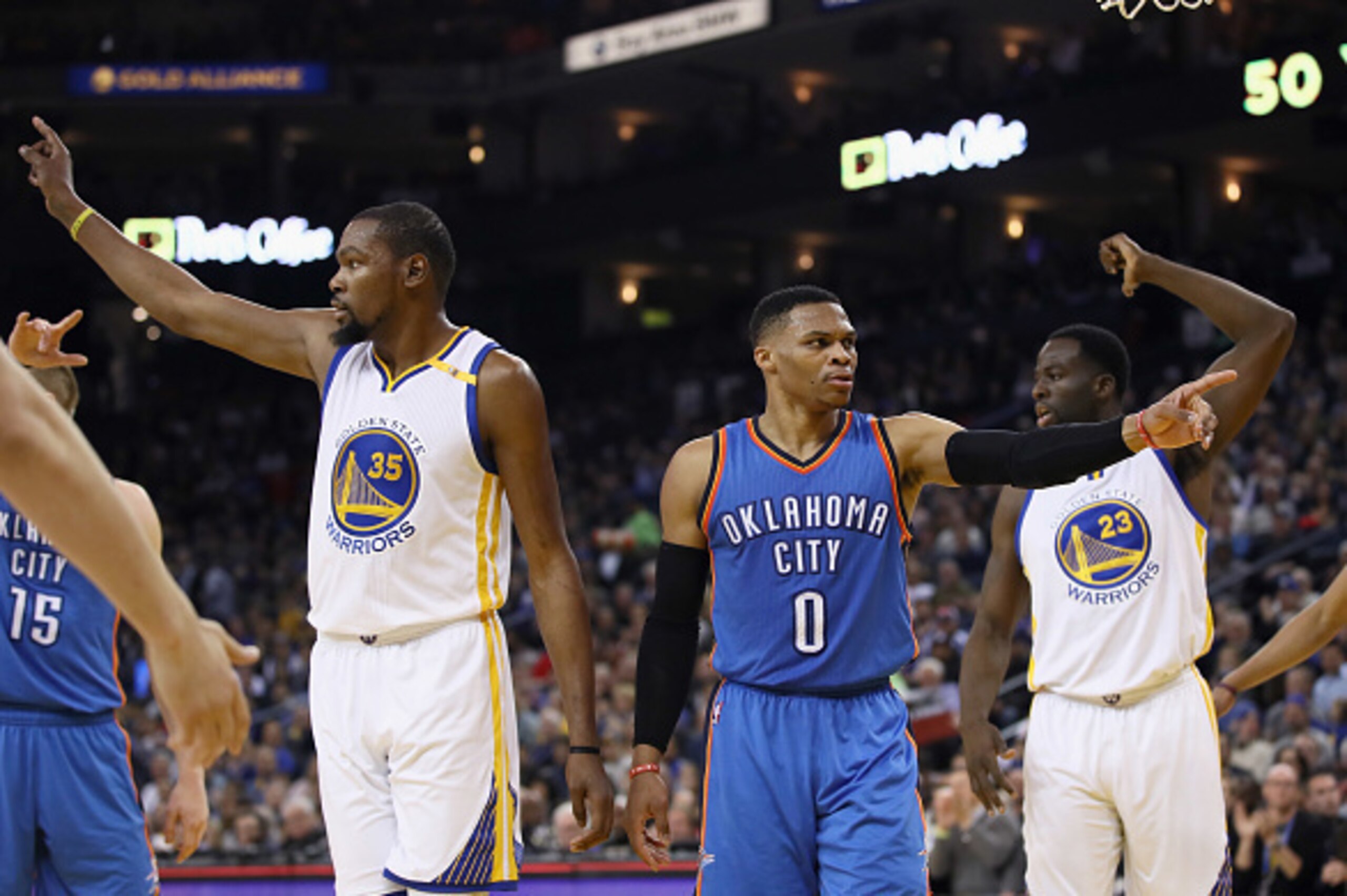 OAKLAND, CA - JANUARY 18:  Kevin Durant #35 of the Golden State Warriors and Russell Westbrook #0 of the Oklahoma City Thunder point in different directions after the ball went out of bounds at ORACLE Arena on January 18, 2017 in Oakland, California.  NOT