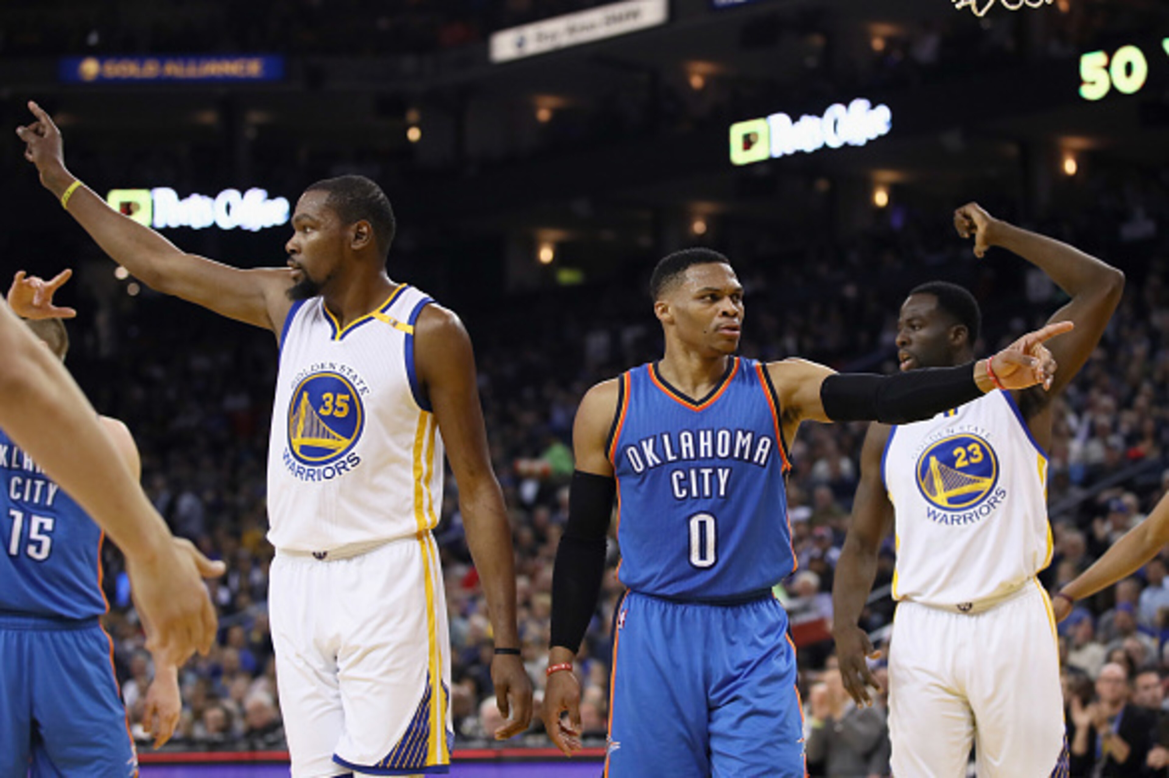 OAKLAND, CA - JANUARY 18:  Kevin Durant #35 of the Golden State Warriors and Russell Westbrook #0 of the Oklahoma City Thunder point in different directions after the ball went out of bounds at ORACLE Arena on January 18, 2017 in Oakland, California.  NOT