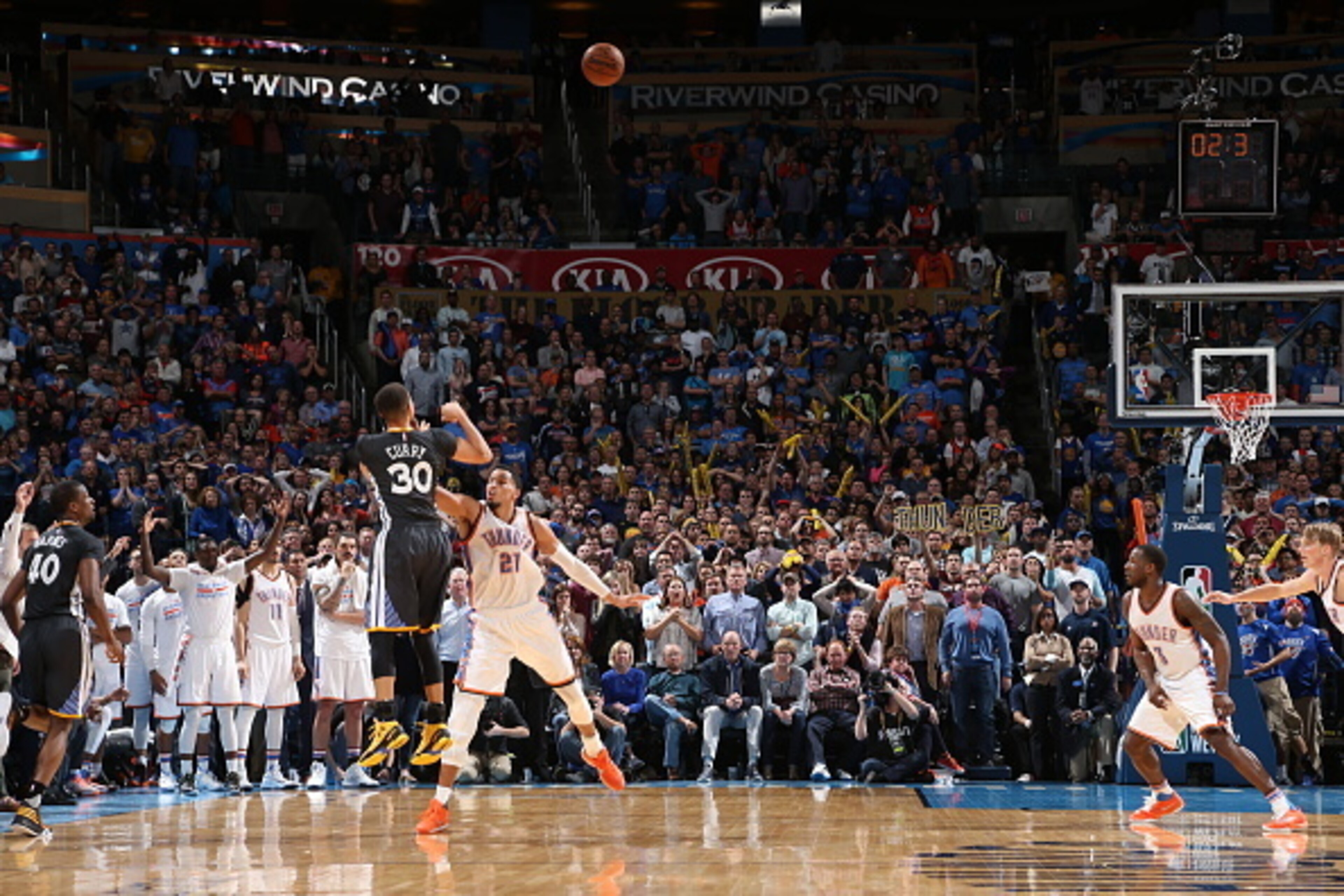 OKLAHOMA CITY, OK - FEBRUARY 27:  Stephen Curry #30 of the Golden State Warriors hits the winning shot against Andre Roberson #21 of the Oklahoma City Thunder on February 27, 2016 at Chesapeake Energy Arena in Oklahoma City, Oklahoma. NOTE TO USER: User e