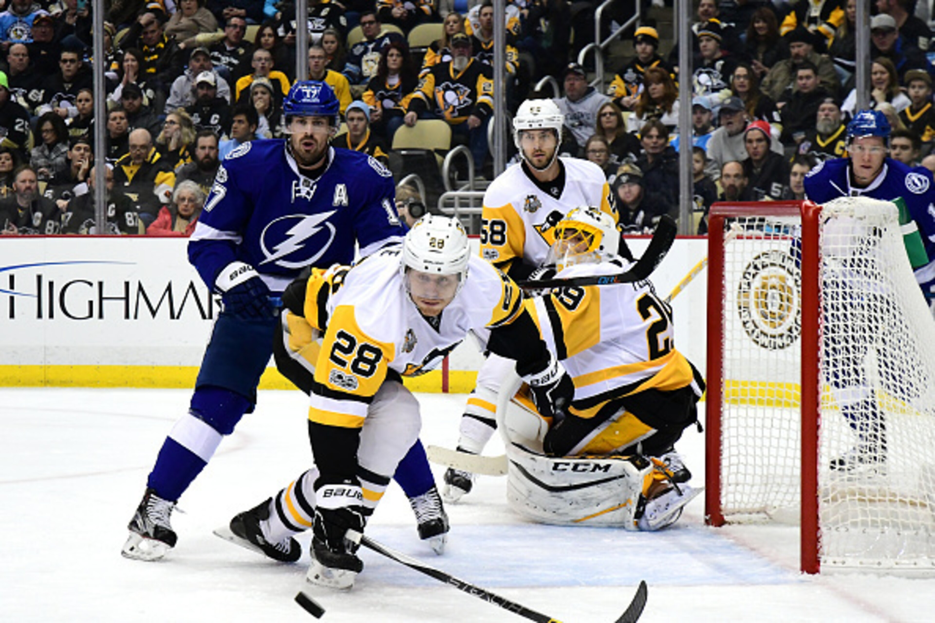 PITTSBURGH, PA - JANUARY 08: Ian Cole #28 of the Pittsburgh Penguins reaches for the puck against the Tampa Bay Lightning at PPG PAINTS Arena on January 8, 2017 in Pittsburgh, Pennsylvania. (Photo by Matt Kincaid/Getty Images) PITTSBURGH, PA - JANUARY 08: Ian Cole #28 of the Pittsburgh Penguins reaches for the puck against the Tampa Bay Lightning at PPG PAINTS Arena on January 8, 2017 in Pittsburgh, Pennsylvania. (Photo by Matt Kincaid/Getty Images)
