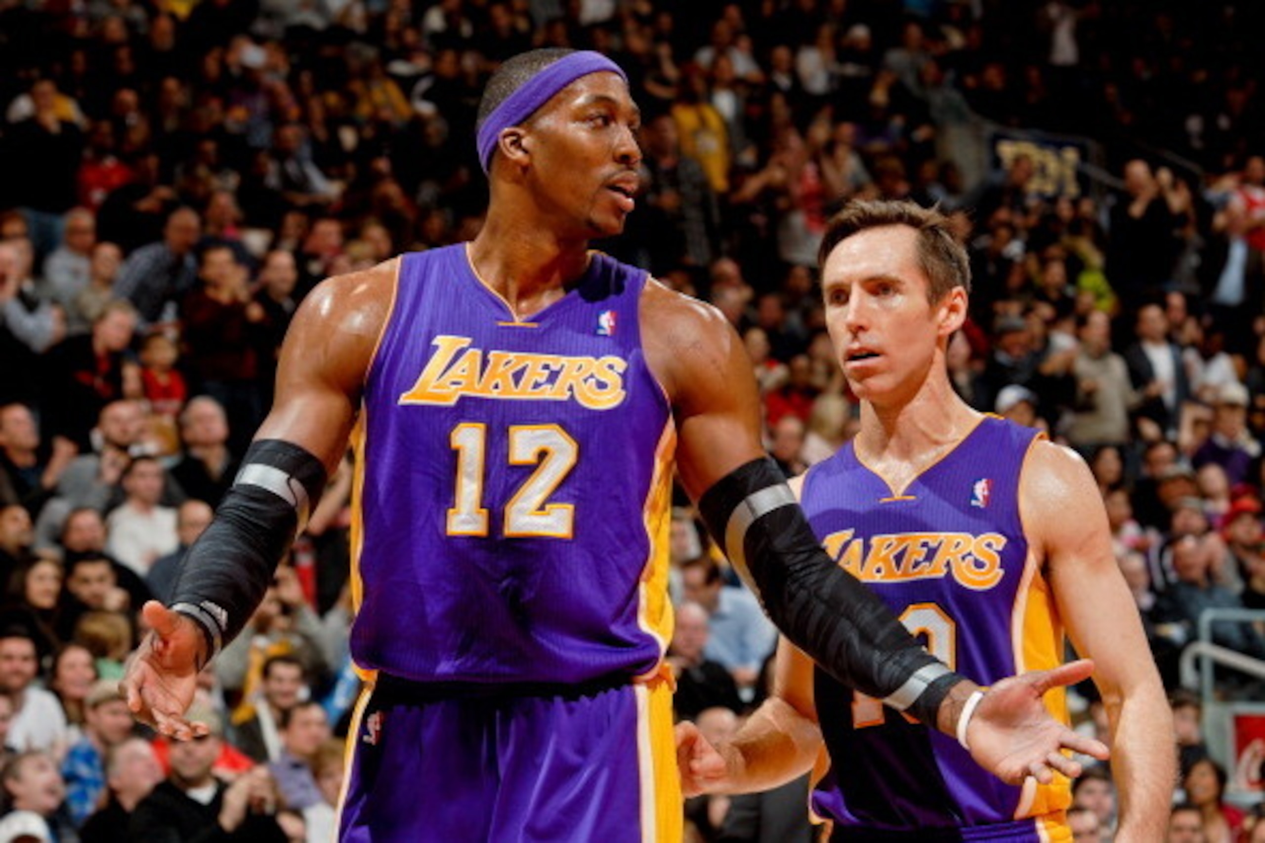TORONTO, CANADA - JANUARY 20: Dwight Howard #12 and Steve Nash #10 of the Los Angeles Lakers speak during a game against the Toronto Raptors on January 20, 2013 at the Air Canada Centre in Toronto, Ontario, Canada. NOTE TO USER: User expressly acknowledg TORONTO, CANADA - JANUARY 20: Dwight Howard #12 and Steve Nash #10 of the Los Angeles Lakers speak during a game against the Toronto Raptors on January 20, 2013 at the Air Canada Centre in Toronto, Ontario, Canada. NOTE TO USER: User expressly acknowledg