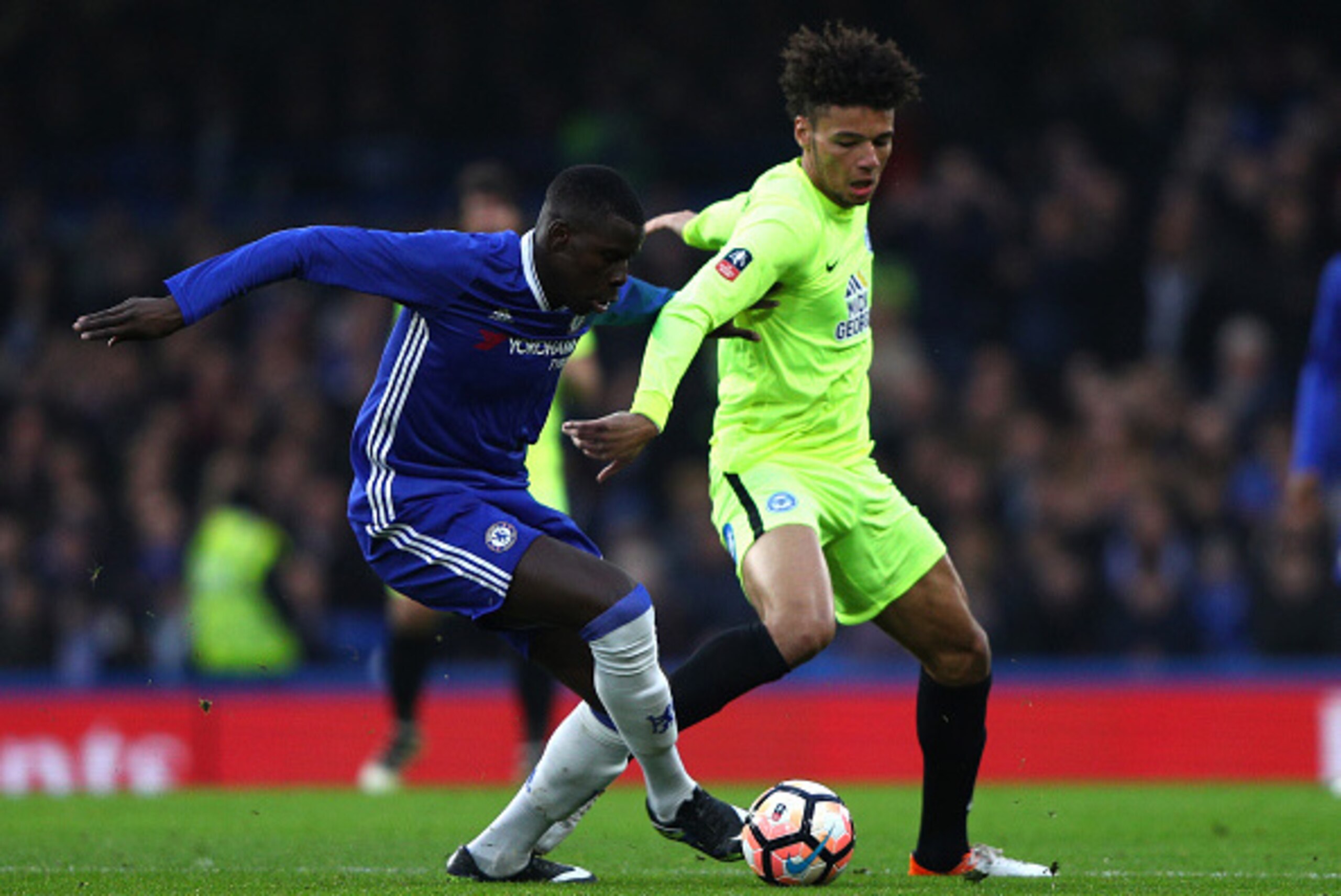 LONDON, ENGLAND - JANUARY 08:  Lee Angol of Peterborough United (R) and Kurt Zouma of Chelsea (L) battle for possession during The Emirates FA Cup Third Round match between Chelsea and Peterborough United at Stamford Bridge on January 8, 2017 in London, E