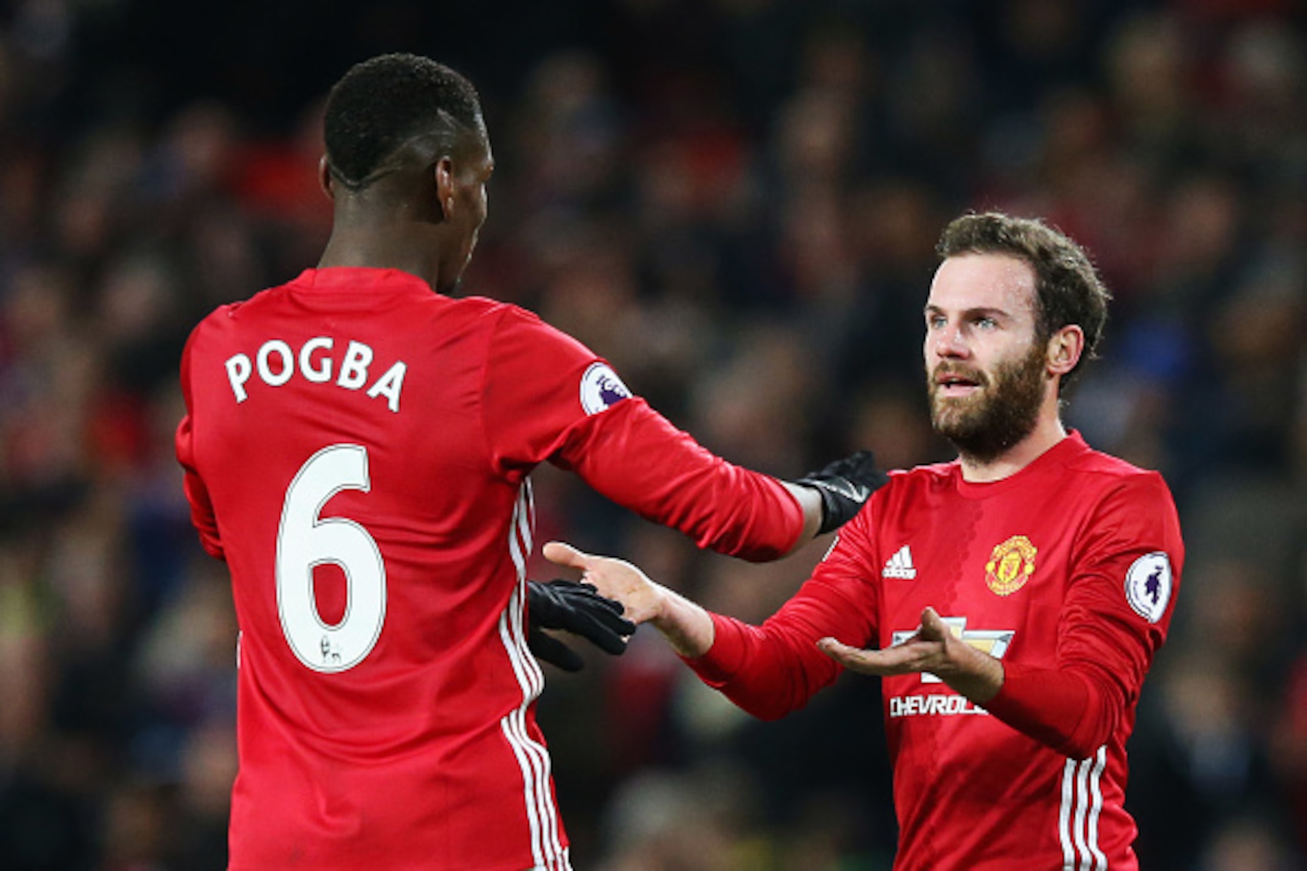 MANCHESTER, ENGLAND - DECEMBER 31:  Paul Pogba of Manchester United celebrates with team mate Juan Mata after victory in the Premier League match between Manchester United and Middlesbrough at Old Trafford on December 31, 2016 in Manchester, England.  (Ph