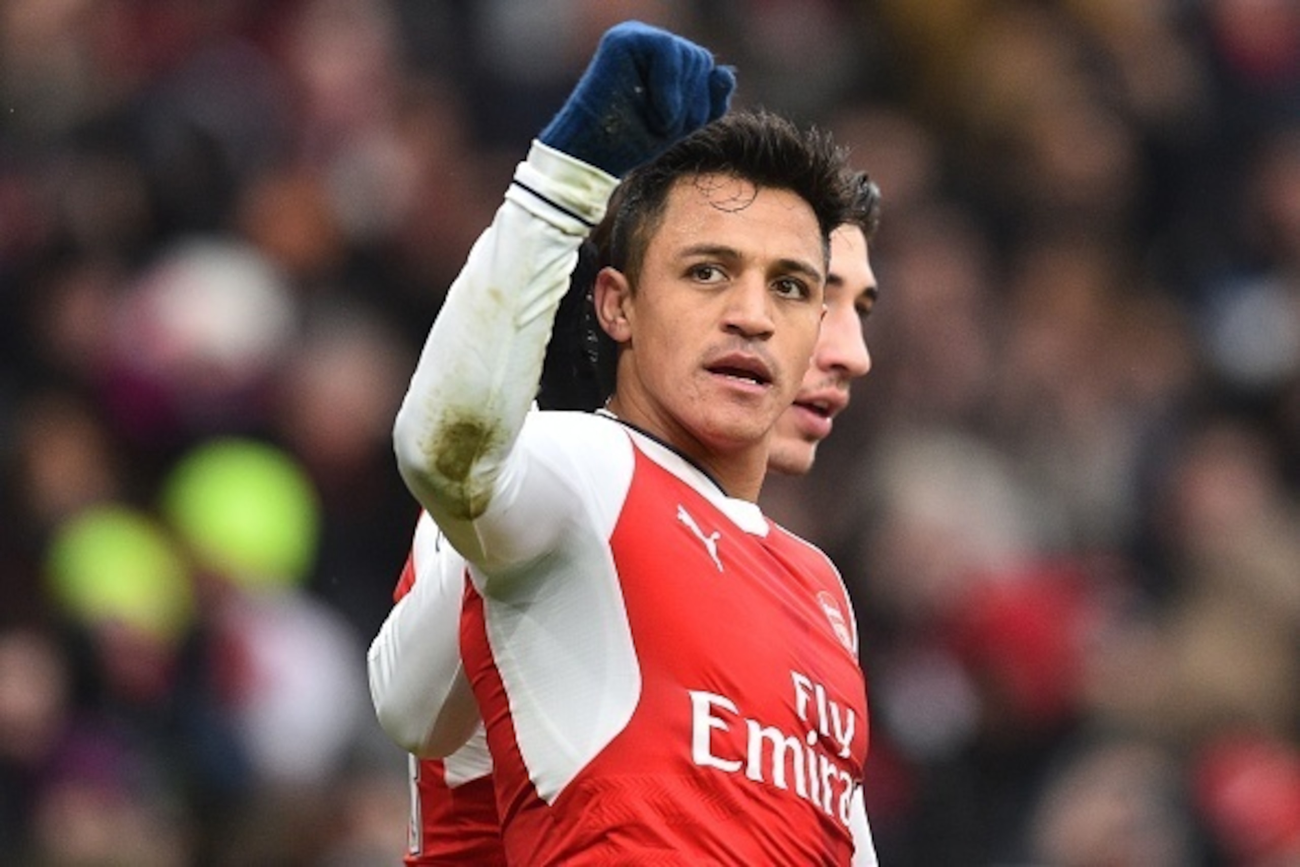 Arsenal's Chilean striker Alexis Sanchez (L) celebrates with Arsenal's Spanish defender Hector Bellerin after scoring the opening goal of the English Premier League football match between Arsenal and Hull City at the Emirates Stadium in London on February