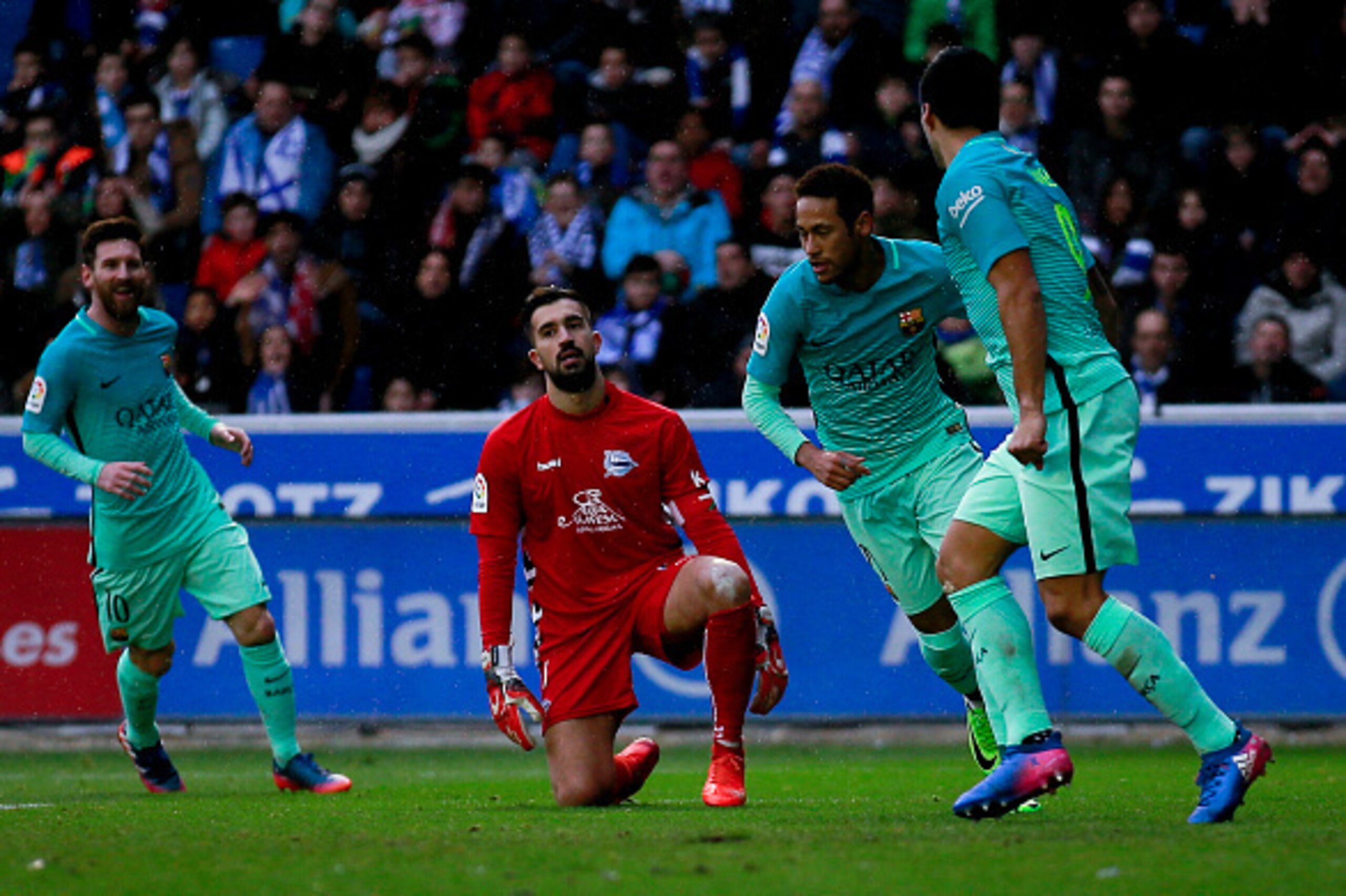 VITORIA-GASTEIZ, SPAIN - FEBRUARY 11:  Neymar JR. (2ndR) of FC Barcelona celebrates scoring their second goal with teammate Luis Suarez (R) and Lionel Messi (L) during the La Liga match between Deportivo Alaves and FC Barcelona at Estadio de Mendizorroza 