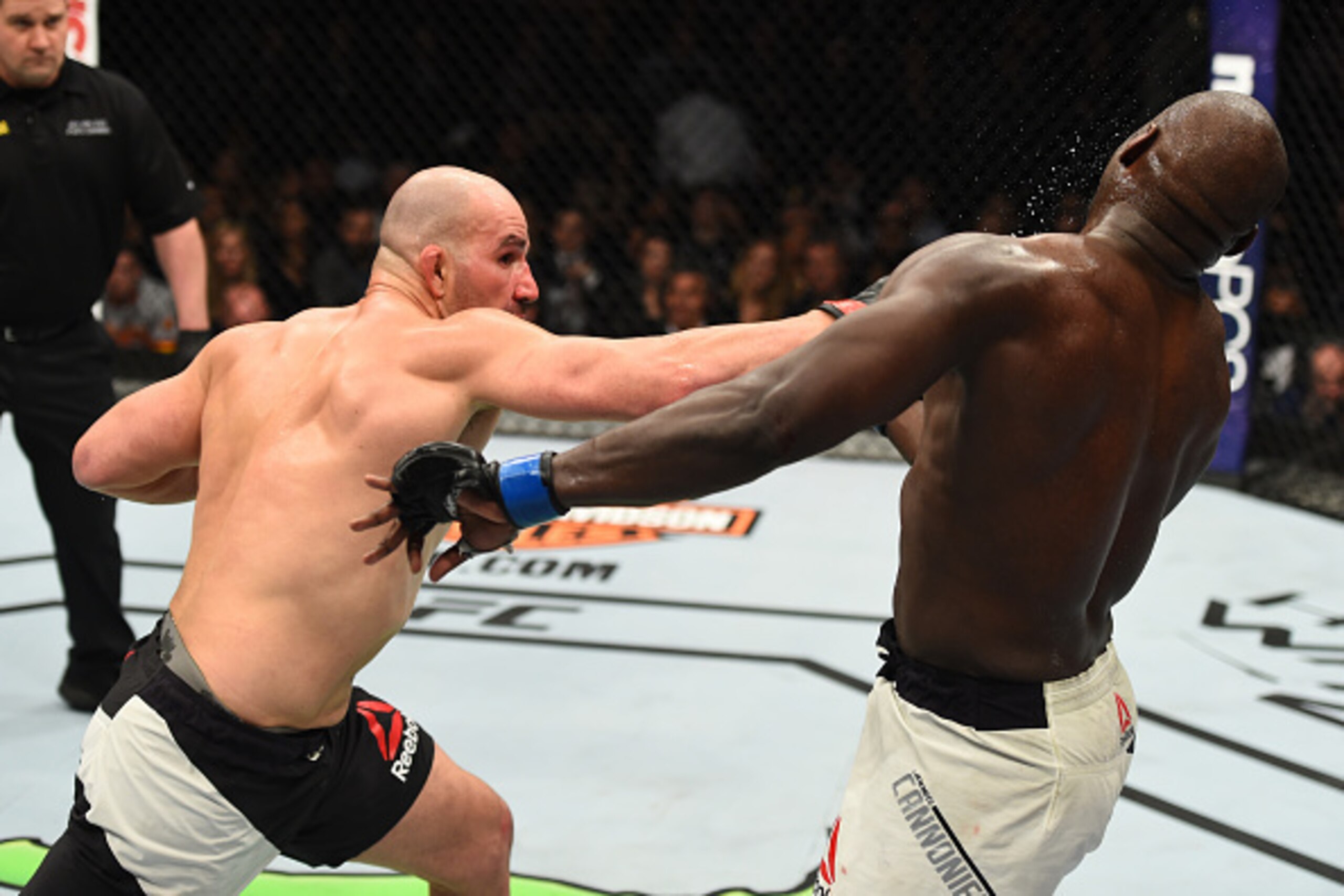 BROOKLYN, NEW YORK - FEBRUARY 11:  (L-R) Glover Teixeira of Brazil punches Jared Cannonier in their light heavyweight bout during the UFC 208 event inside Barclays Center on February 11, 2017 in Brooklyn, New York. (Photo by Jeff Bottari/Zuffa LLC/Zuffa L