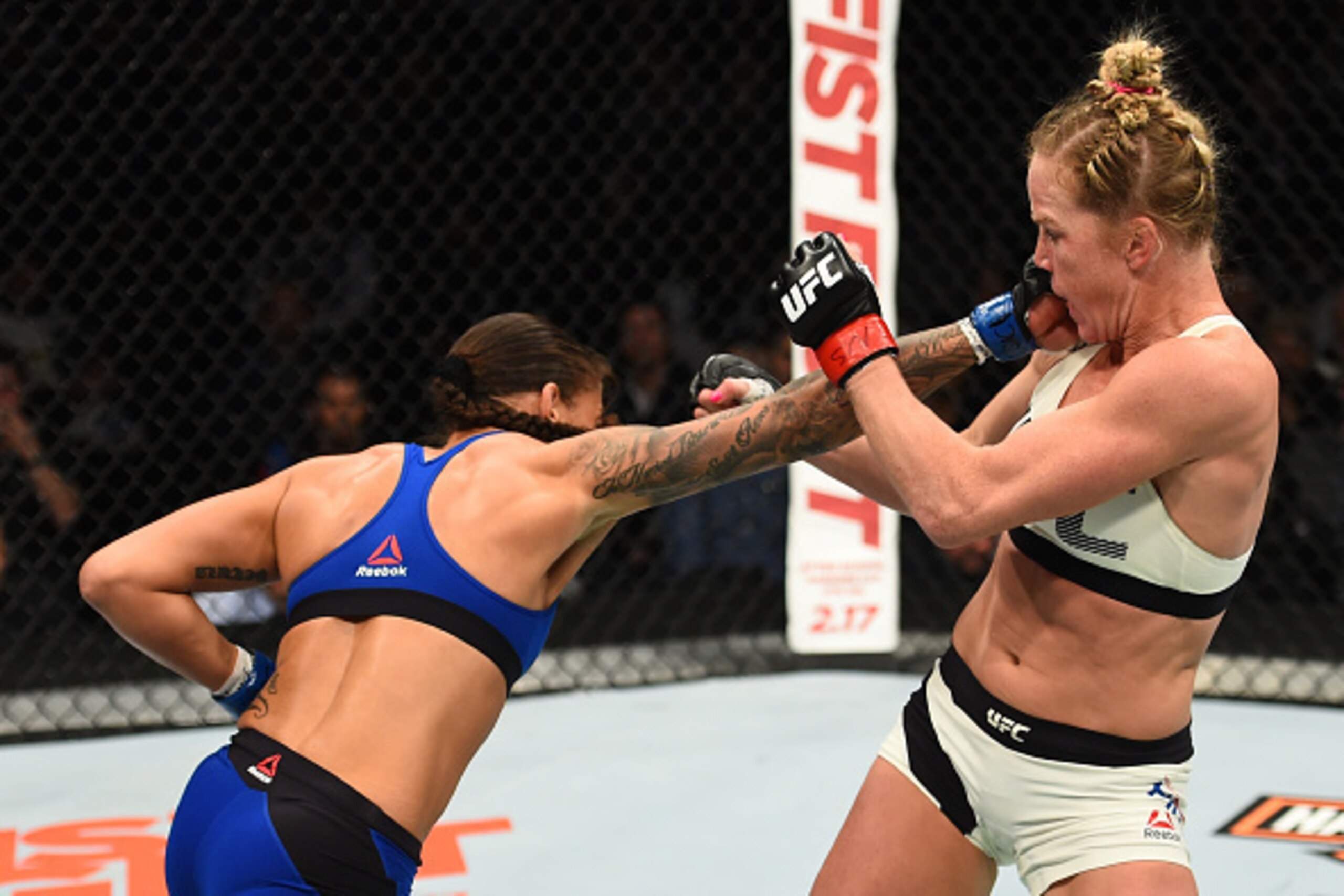 BROOKLYN, NEW YORK - FEBRUARY 11:  (L-R) Germaine de Randamie of The Netherlands punches Holly Holm in their women's featherweight championship bout during the UFC 208 event inside Barclays Center on February 11, 2017 in Brooklyn, New York. (Photo by Jeff