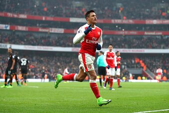 LONDON, ENGLAND - FEBRUARY 11:  Alexis Sanchez of Arsenal celebrates scoring his side's second goal from the penalty spot during the Premier League match between Arsenal and Hull City at Emirates Stadium on February 11, 2017 in London, England.  (Photo by