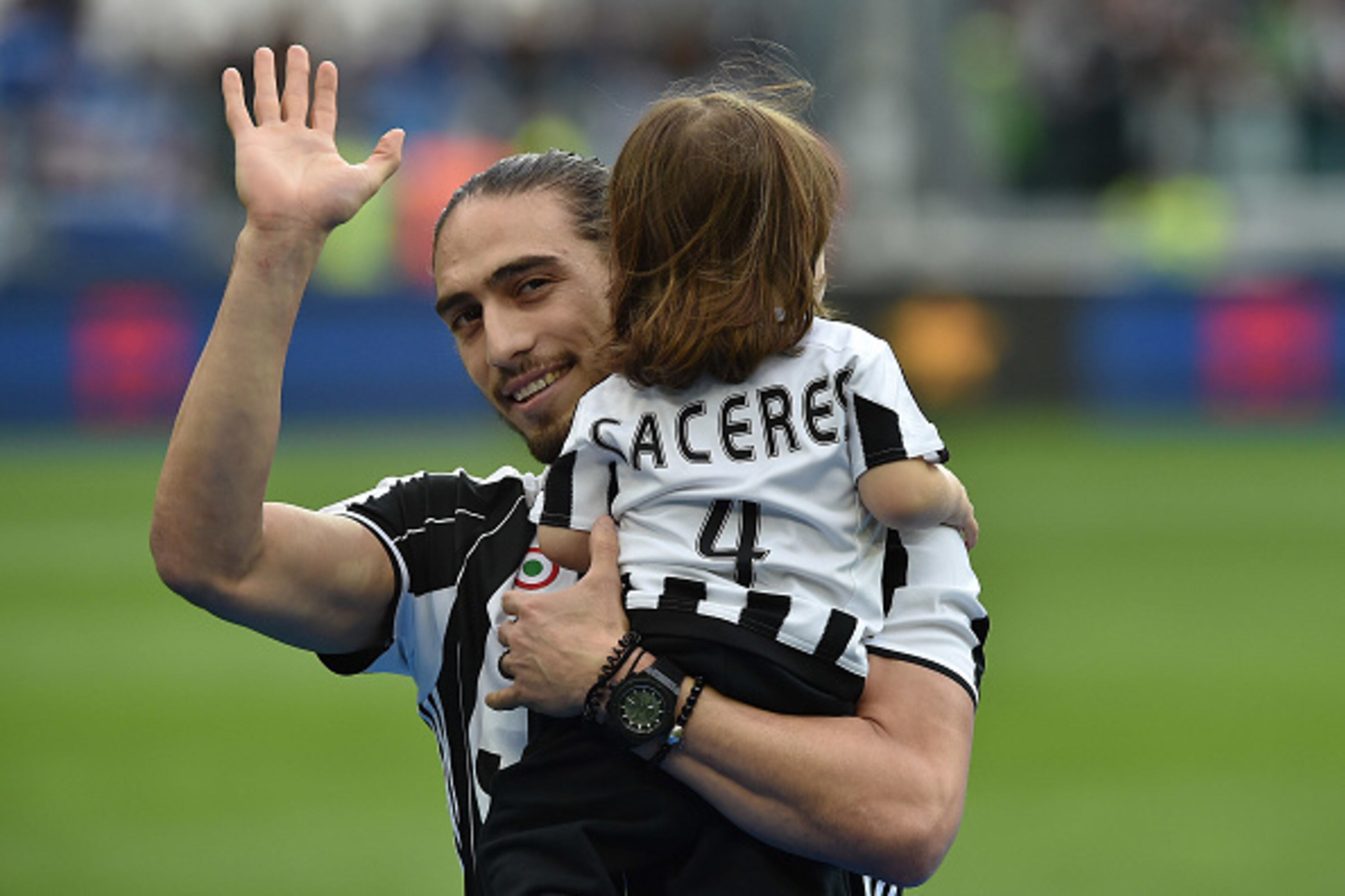 TURIN, ITALY - MAY 14:  Martin Caceres of Juventus FC with his children celebrates after beating UC Sampdoria 5-0 to win the Serie A Championships after the Serie A match between Juventus FC and UC Sampdoria at Juventus Arena on May 14, 2016 in Turin, Ita