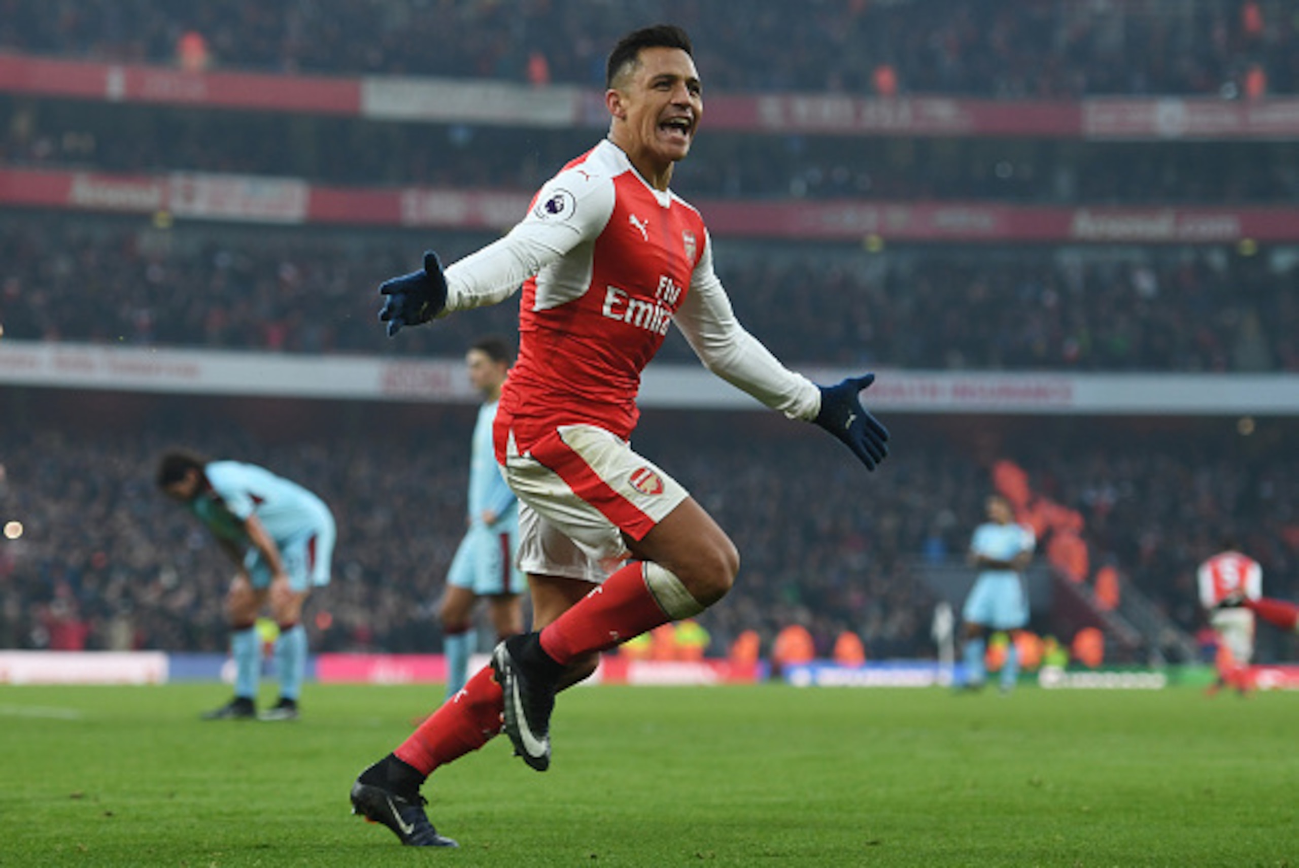 LONDON, ENGLAND - JANUARY 22: Alexis Sanchez of Arsenal celebrates scoring his team's second goal during the Premier League match between Arsenal and Burnley at the Emirates Stadium on January 22, 2017 in London, England. (Photo by Shaun Botterill/Getty LONDON, ENGLAND - JANUARY 22: Alexis Sanchez of Arsenal celebrates scoring his team's second goal during the Premier League match between Arsenal and Burnley at the Emirates Stadium on January 22, 2017 in London, England. (Photo by Shaun Botterill/Getty