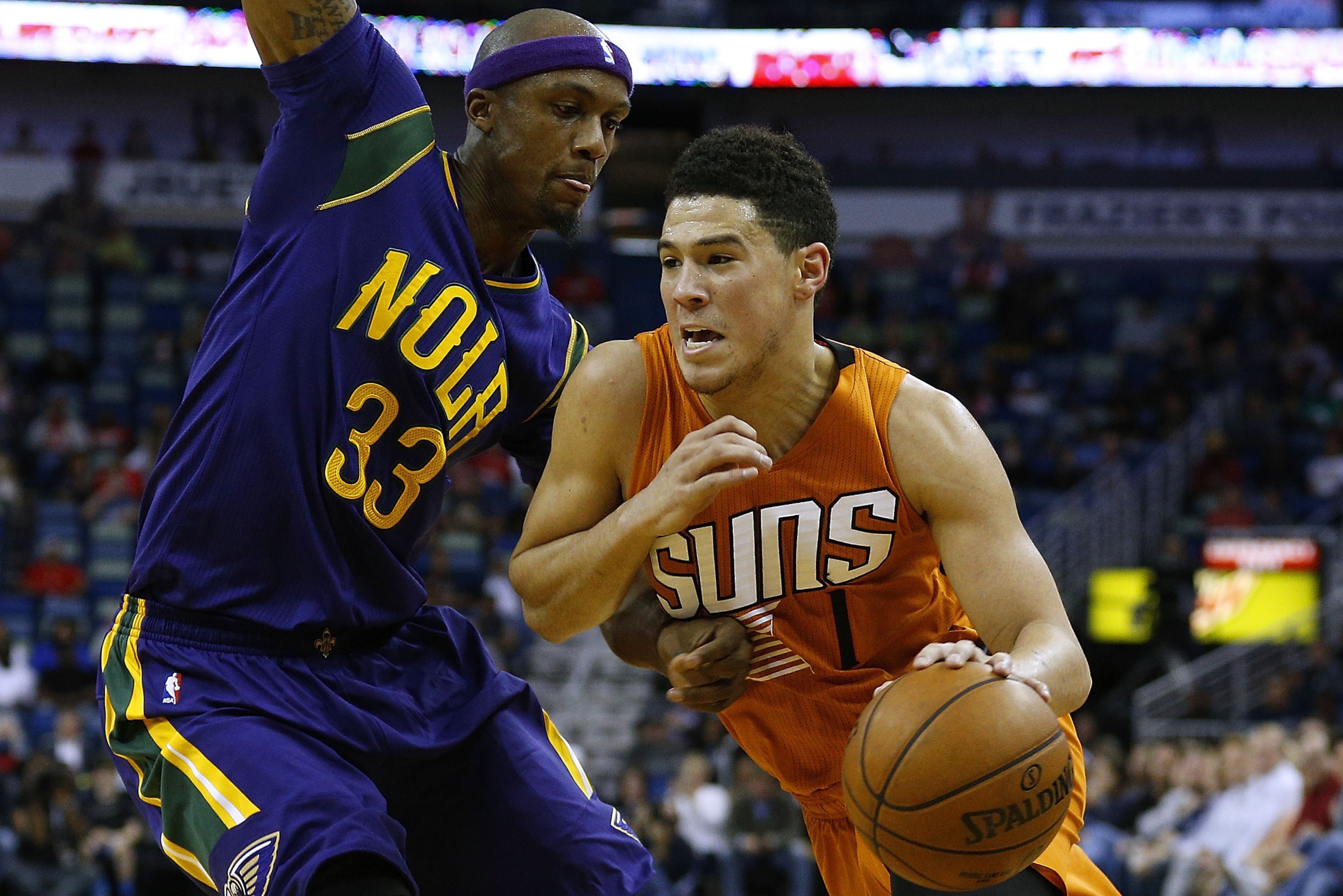 NEW ORLEANS, LA - FEBRUARY 06: Devin Booker #1 of the Phoenix Suns drives against Dante Cunningham #33 of the New Orleans Pelicans during the first half of a game at the Smoothie King Center on February 6, 2017 in New Orleans, Louisiana. NOTE TO USER: Use NEW ORLEANS, LA - FEBRUARY 06: Devin Booker #1 of the Phoenix Suns drives against Dante Cunningham #33 of the New Orleans Pelicans during the first half of a game at the Smoothie King Center on February 6, 2017 in New Orleans, Louisiana. NOTE TO USER: Use
