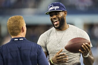 ARLINGTON, TX - SEPTEMBER 08:  LeBron James is greeted by Head Coach Jason Garrett of the Dallas Cowboys before a game against the New York Giants at AT&T Stadium on September 8, 2013 in Arlington, Texas.  The Cowboys defeated the Giants 36-31.  (Photo by