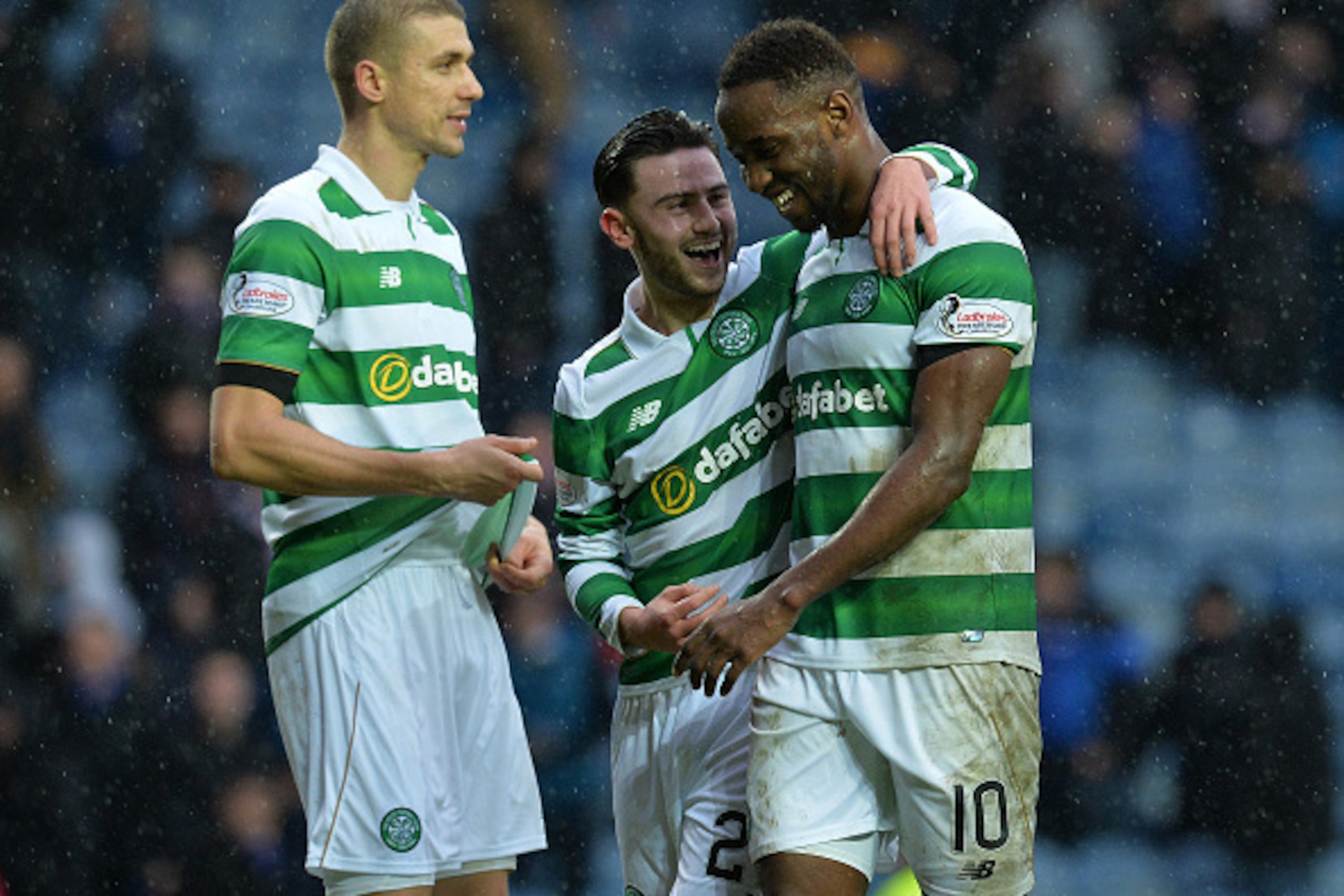 GLASGOW, SCOTLAND - DECEMBER 31: Moussa Dembele of Celtic celebrate at the final Whistle with teams mate Patrick Roberts and Jozo Simunovic during the Scottish Premiership match between Rangers FC and Celtic FC at Ibrox Stadium on December 31, 2016 in Gla
