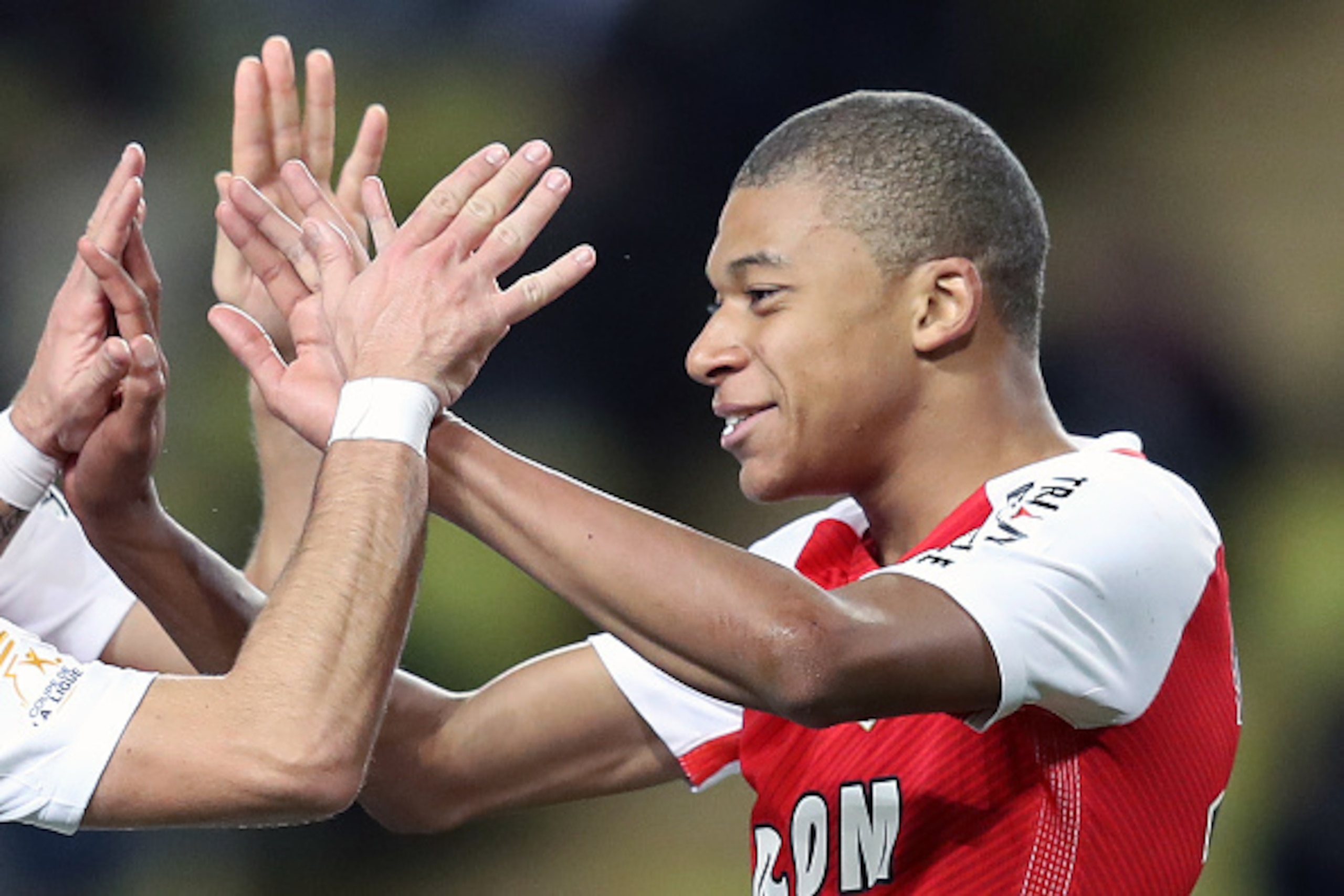 Monaco's French forward Kylian Mbappe Lottin celebrates after scoring a goal during a French League Cup football match between Monaco (ASM) vs Rennes (SRFC) at the 'Louis II' stadium in Monaco on December 14, 2016.   / AFP / VALERY HACHE        (Photo cre