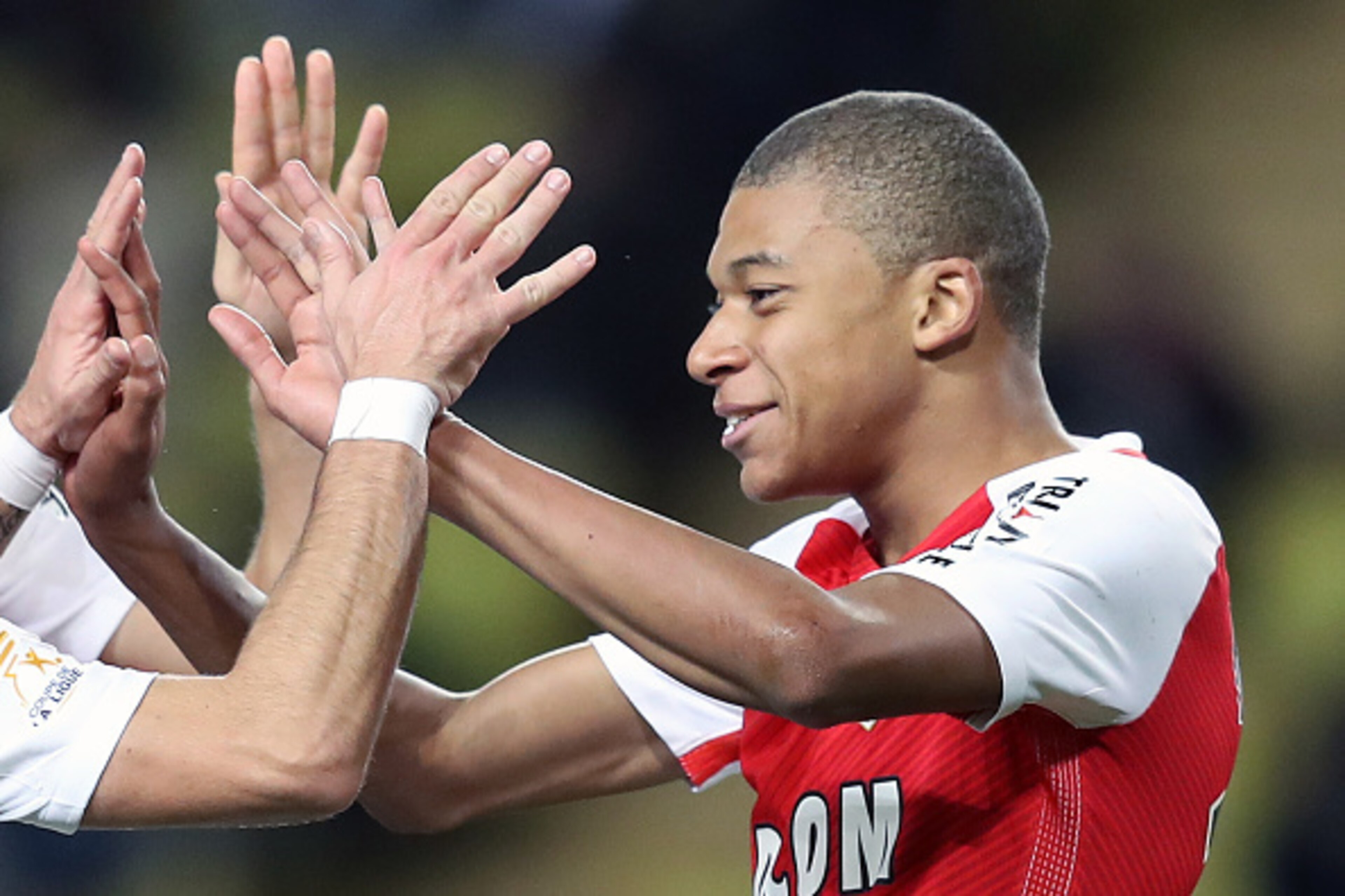 Monaco's French forward Kylian Mbappe Lottin celebrates after scoring a goal during a French League Cup football match between Monaco (ASM) vs Rennes (SRFC) at the 'Louis II' stadium in Monaco on December 14, 2016.   / AFP / VALERY HACHE        (Photo cre