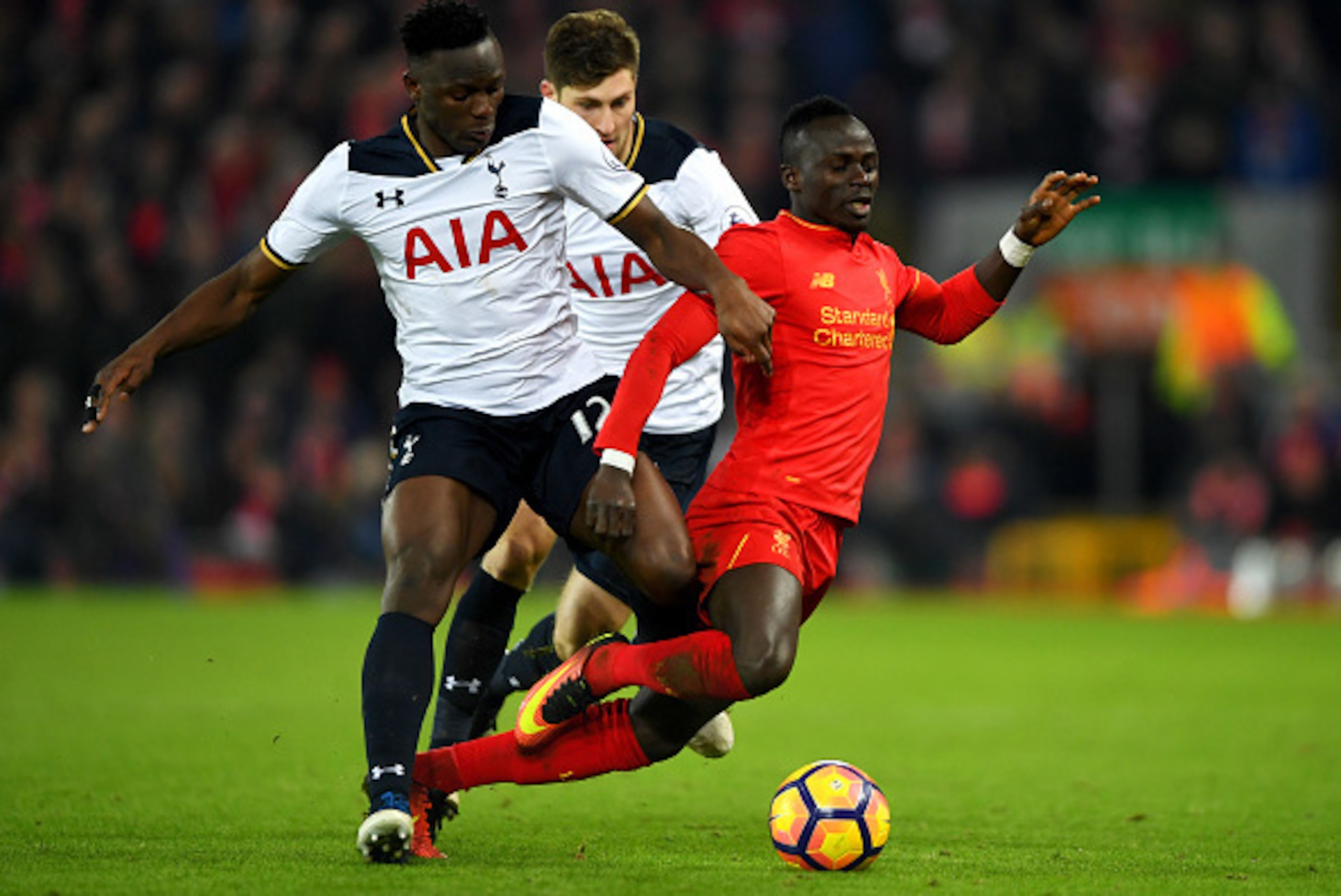 LIVERPOOL, ENGLAND - FEBRUARY 11:  Sadio Mane of Liverpool and Victor Wanyama of Tottenham Hotspur compete for the ball during the Premier League match between Liverpool and Tottenham Hotspur at Anfield on February 11, 2017 in Liverpool, England.  (Photo 