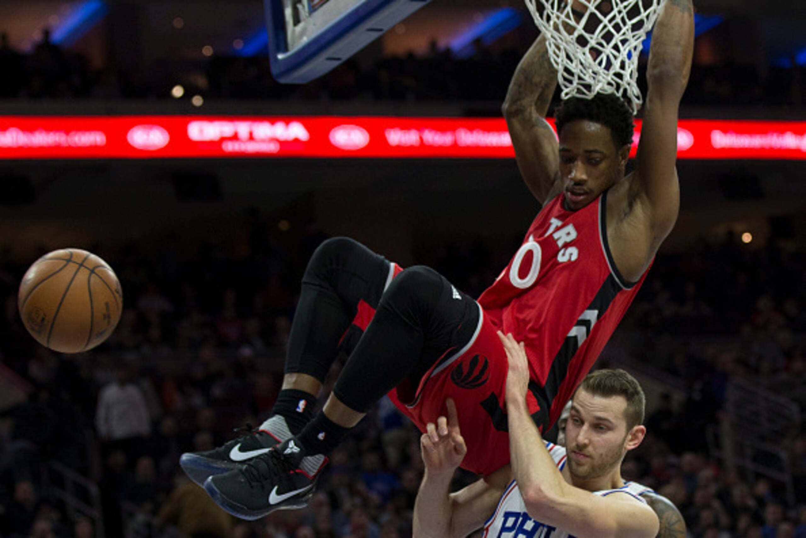 PHILADELPHIA, PA - DECEMBER 14: DeMar DeRozan #10 of the Toronto Raptors dunks the ball past Nik Stauskas #11 of the Philadelphia 76ers in the third quarter at Wells Fargo Center on December 14, 2016 in Philadelphia, Pennsylvania. The Raptors defeated the