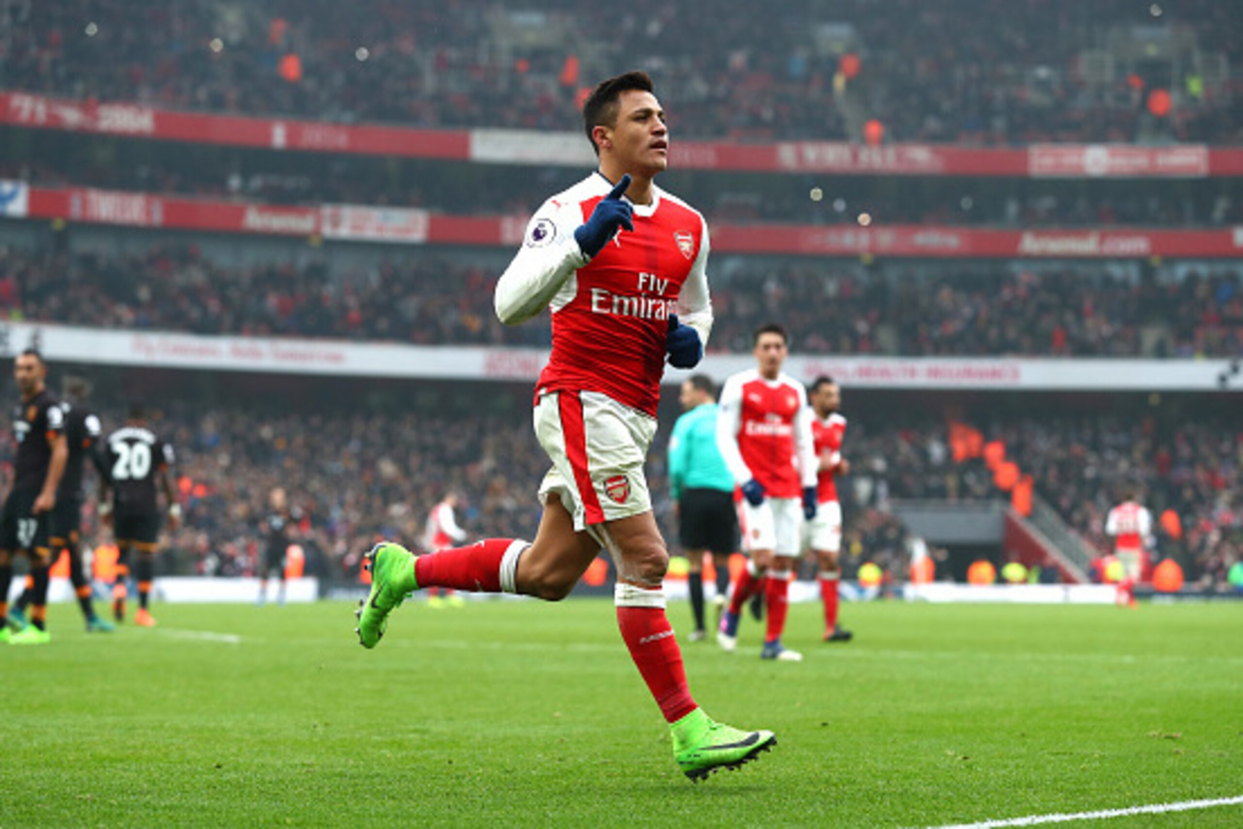 LONDON, ENGLAND - FEBRUARY 11:  Alexis Sanchez of Arsenal celebrates scoring his side's second goal from the penalty spot during the Premier League match between Arsenal and Hull City at Emirates Stadium on February 11, 2017 in London, England.  (Photo by