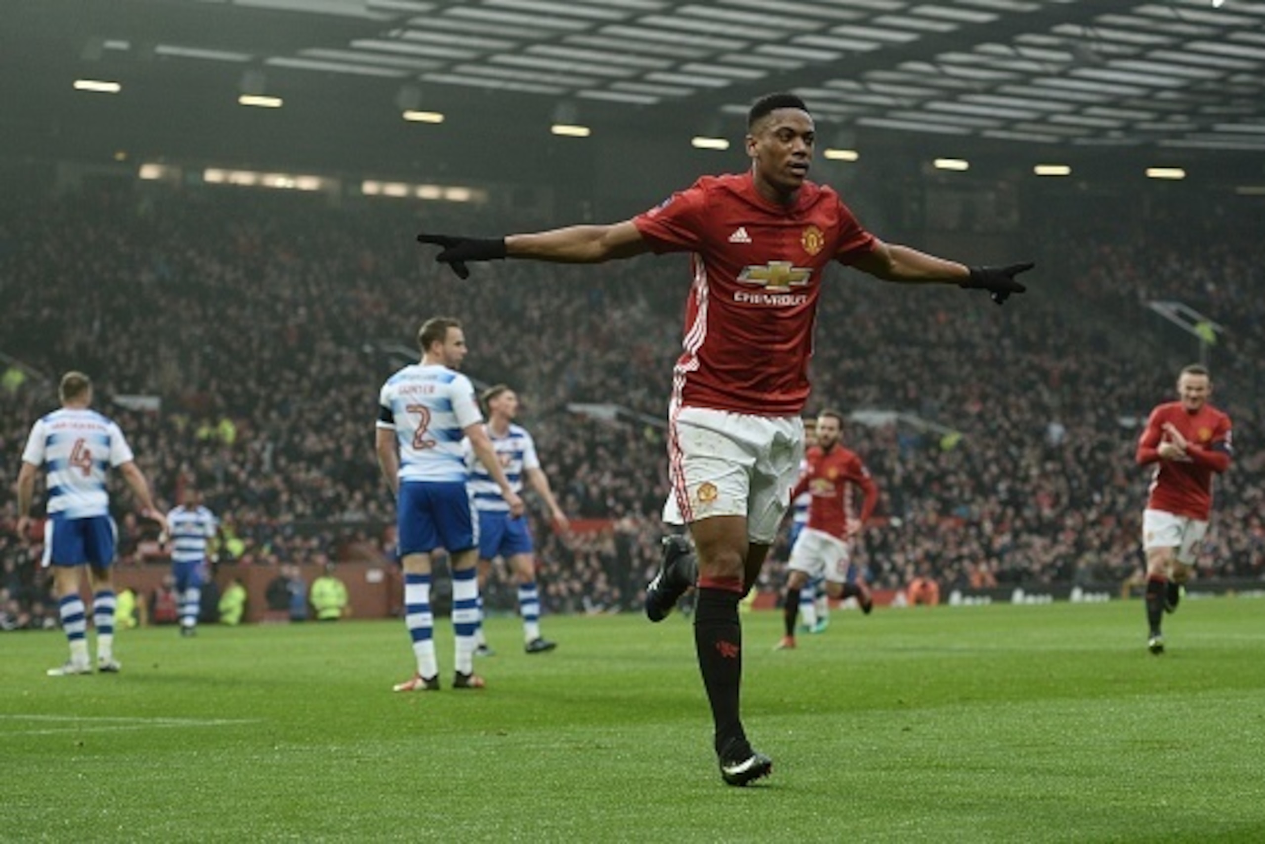 Manchester United's French striker Anthony Martial celebrates scoring their second goal during the English FA Cup third round football match between Manchester United and Reading at Old Trafford in Manchester, north west England, on January 7, 2017. / AFP