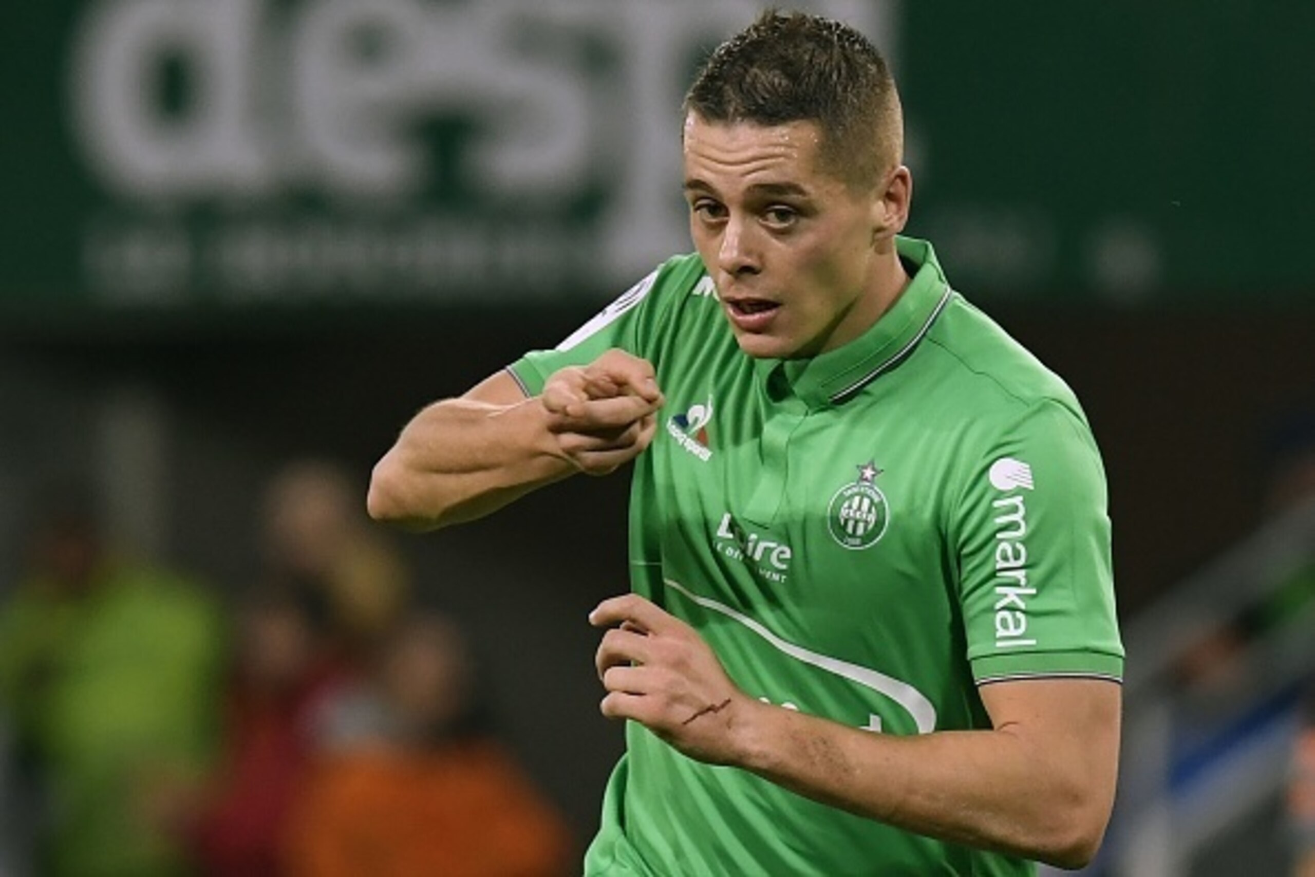 Saint-Etienne's French midfielder Romain Hamouma reacts after scoring a goal during the French L1 Football match between AS Saint-Etienne and Lorient FC on February 12, 2017, at the Geoffroy Guichard stadium in Saint-Etienne, central France. / AFP / PHILI