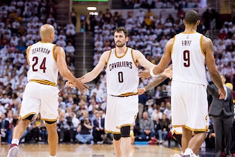 CLEVELAND, OH - APRIL 20: Richard Jefferson #24 and Channing Frye #9 celebrate with Kevin Love #0 of the Cleveland Cavaliers as he enters the game during the second half of the NBA Eastern Conference quarterfinals against the Detroit Pistons at Quicken Lo