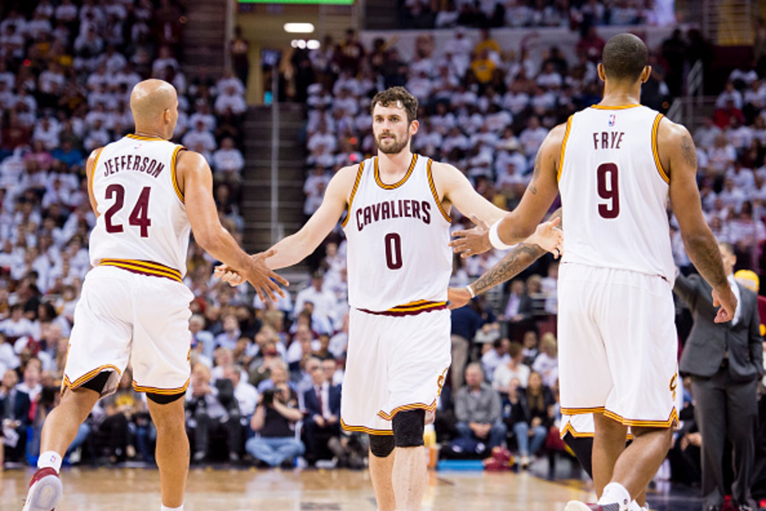 CLEVELAND, OH - APRIL 20: Richard Jefferson #24 and Channing Frye #9 celebrate with Kevin Love #0 of the Cleveland Cavaliers as he enters the game during the second half of the NBA Eastern Conference quarterfinals against the Detroit Pistons at Quicken Lo