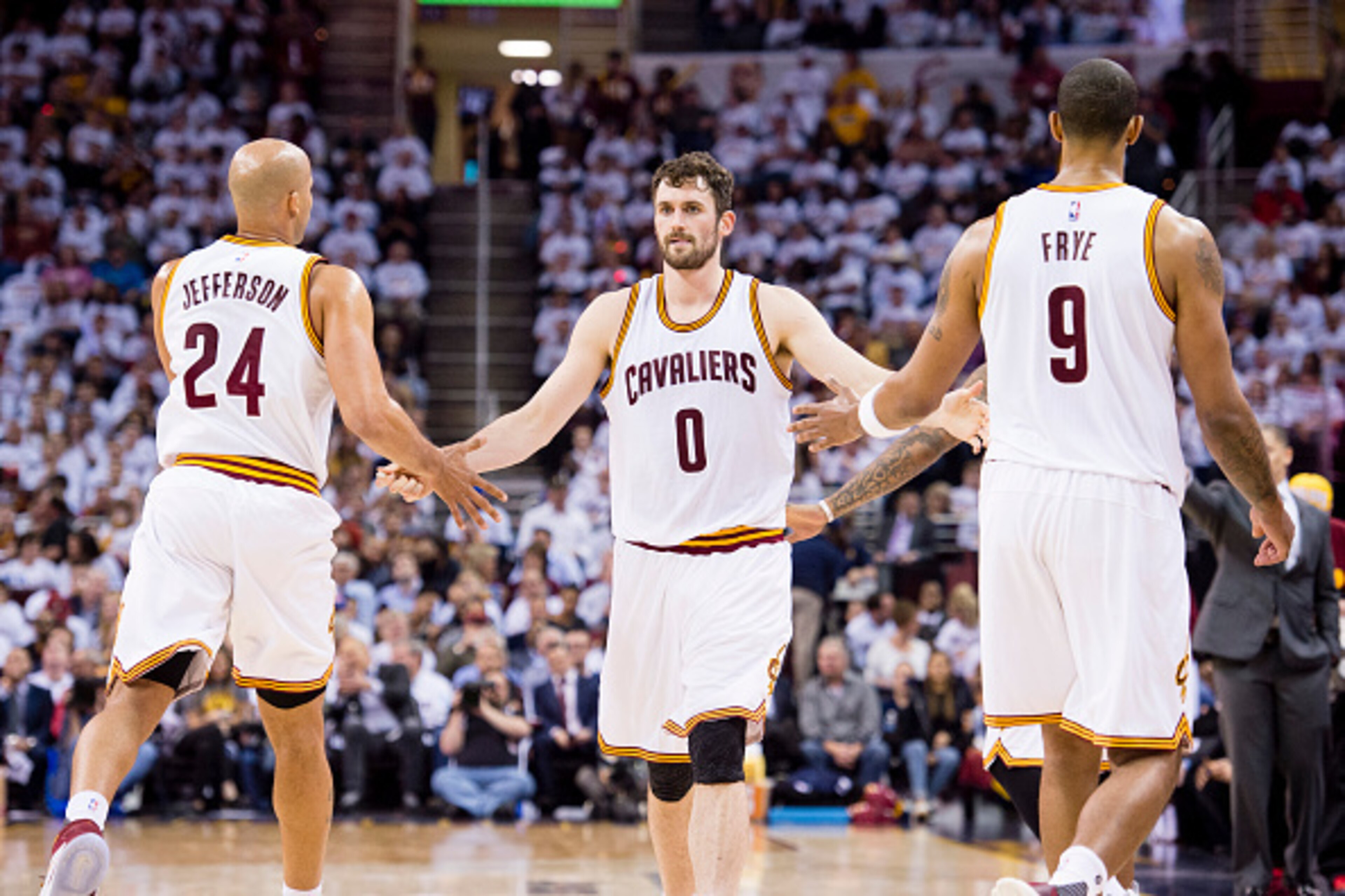 CLEVELAND, OH - APRIL 20: Richard Jefferson #24 and Channing Frye #9 celebrate with Kevin Love #0 of the Cleveland Cavaliers as he enters the game during the second half of the NBA Eastern Conference quarterfinals against the Detroit Pistons at Quicken Lo