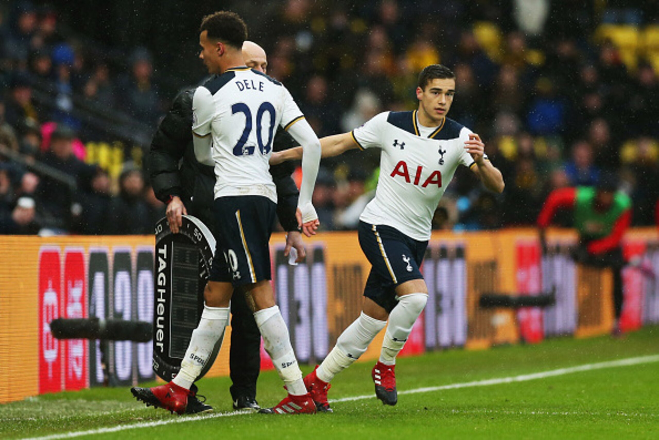 WATFORD, ENGLAND - JANUARY 01:  Dele Alli of Tottenham Hotspur shakes hands with Harry Winks as he is substituted during the Premier League match between Watford and Tottenham Hotspur at Vicarage Road on January 1, 2017 in Watford, England.  (Photo by Ale