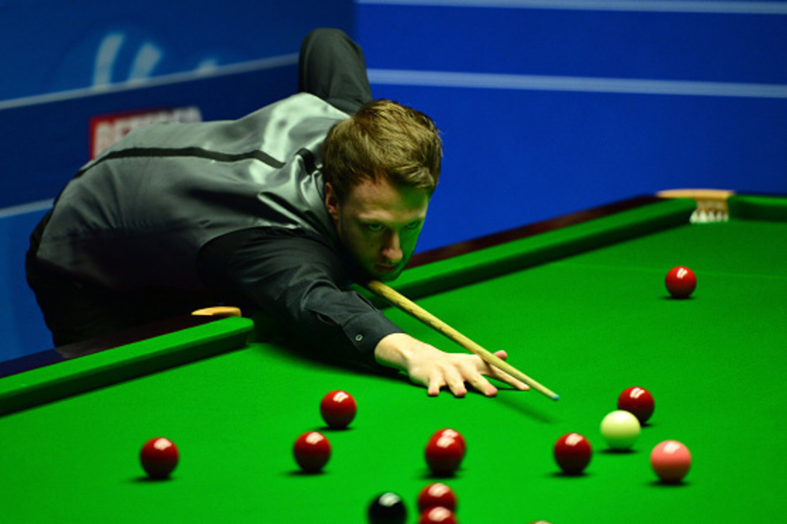 SHEFFIELD, ENGLAND - APRIL 21:  Judd Trump of England plays a shot during his first round match against Liang Wenbo of China on day six of the World Snooker Championship at The Crucible Theatre on April 21, 2016 in Sheffield, England.  (Photo by Dan Mulla