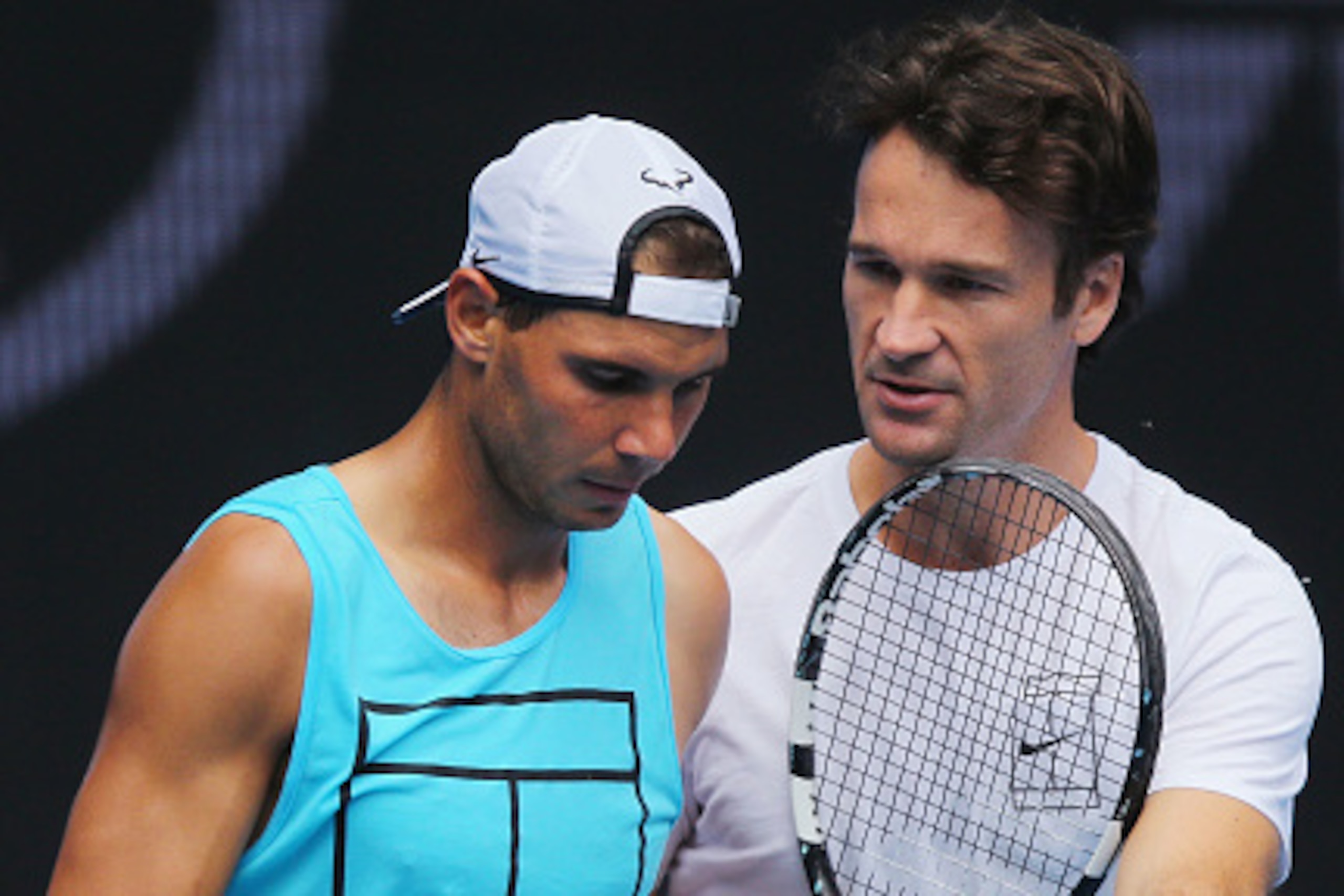 MELBOURNE, AUSTRALIA - JANUARY 15:  Raphael Nadal of Spain listens to coach Carlos Moya during a practice session ahead of the 2017 Australian Open at Melbourne Park on January 15, 2017 in Melbourne, Australia.  (Photo by Michael Dodge/Getty Images)