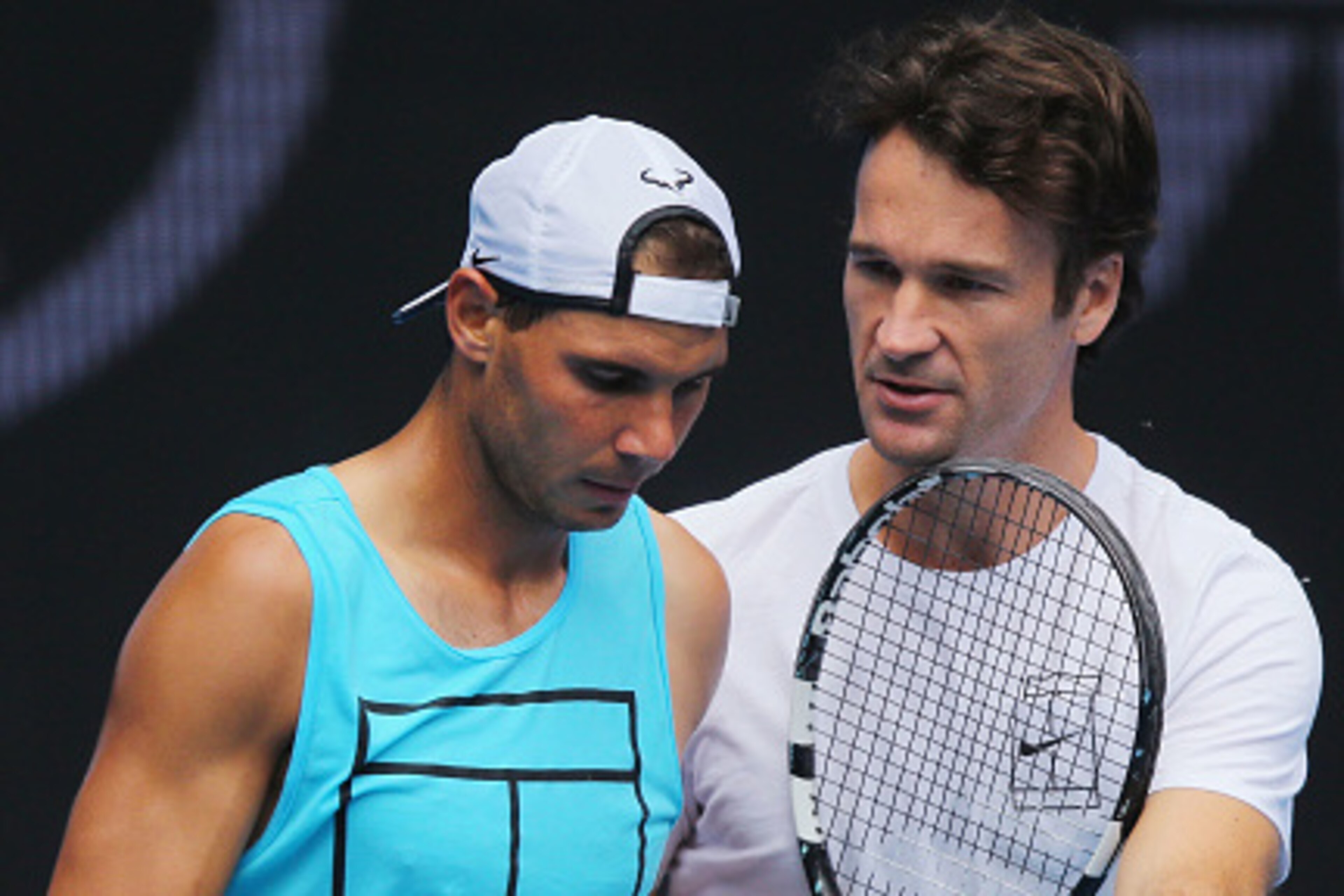 MELBOURNE, AUSTRALIA - JANUARY 15:  Raphael Nadal of Spain listens to coach Carlos Moya during a practice session ahead of the 2017 Australian Open at Melbourne Park on January 15, 2017 in Melbourne, Australia.  (Photo by Michael Dodge/Getty Images)