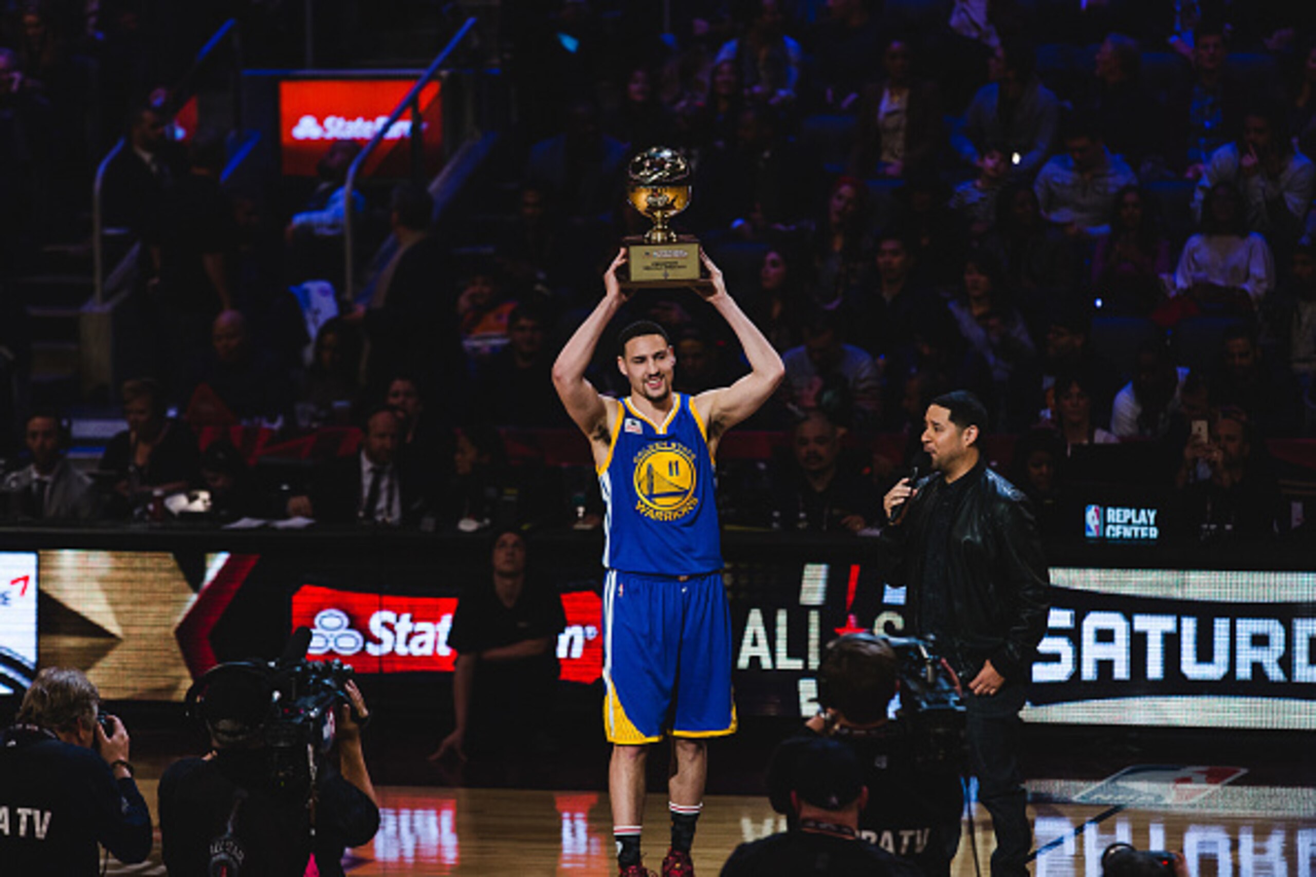 TORONTO, CANADA - FEBRUARY 13:  Klay Thompson #11 of the Golden State Warriors celebrates by holding up his trophy after winning the Foot Locker Three-Point Contest during State Farm All-Star Saturday Night as part of the 2016 NBA All-Star Weekend on Febr