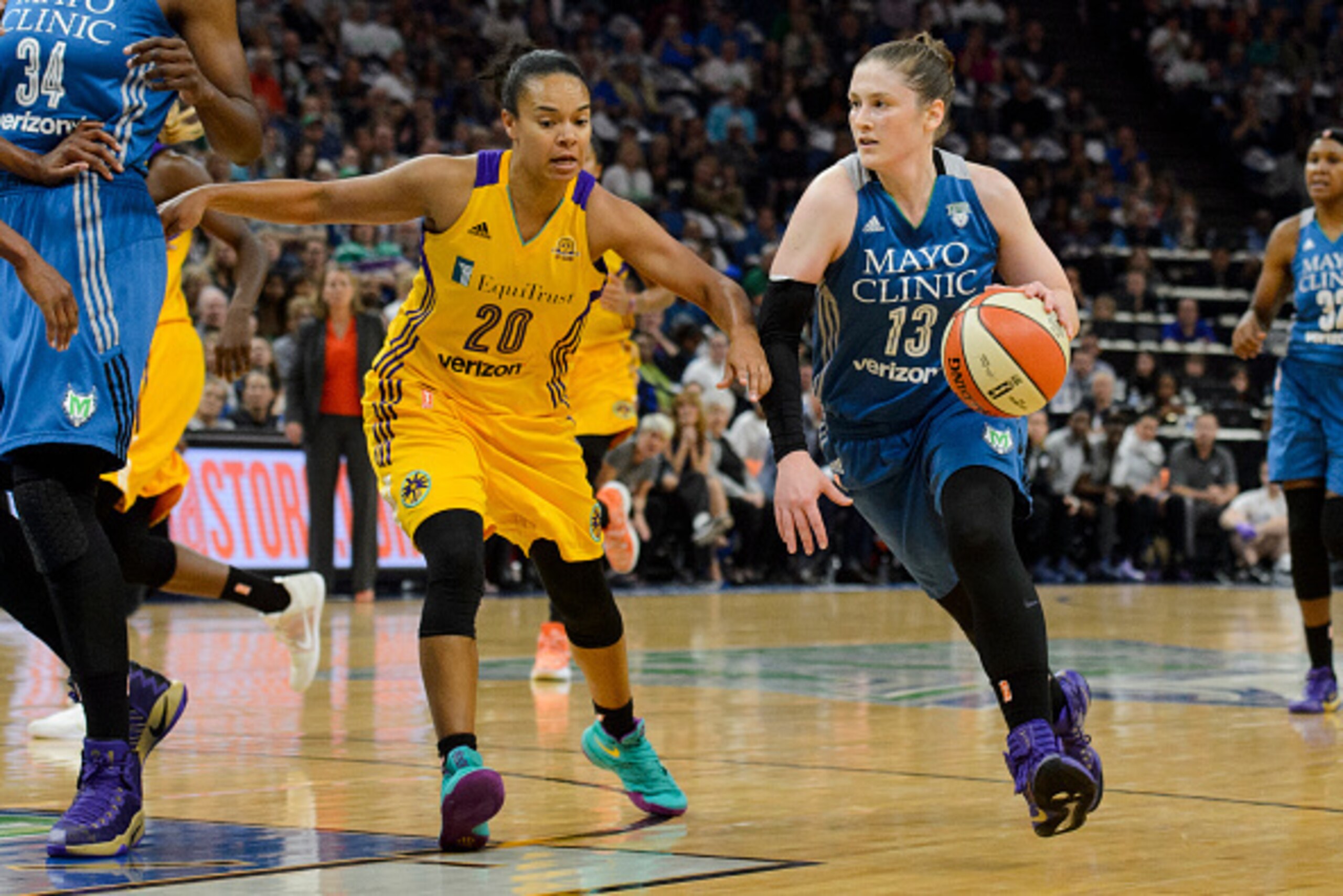 MINNEAPOLIS, MN - OCTOBER 11: Lindsay Whalen #13 of the Minnesota Lynx drives to the basket against Kristi Toliver #20 of the Los Angeles Sparks in Game Two of the 2016 WNBA Finals on October 11, 2016 at Target Center in Minneapolis, Minnesota. The Lynx d