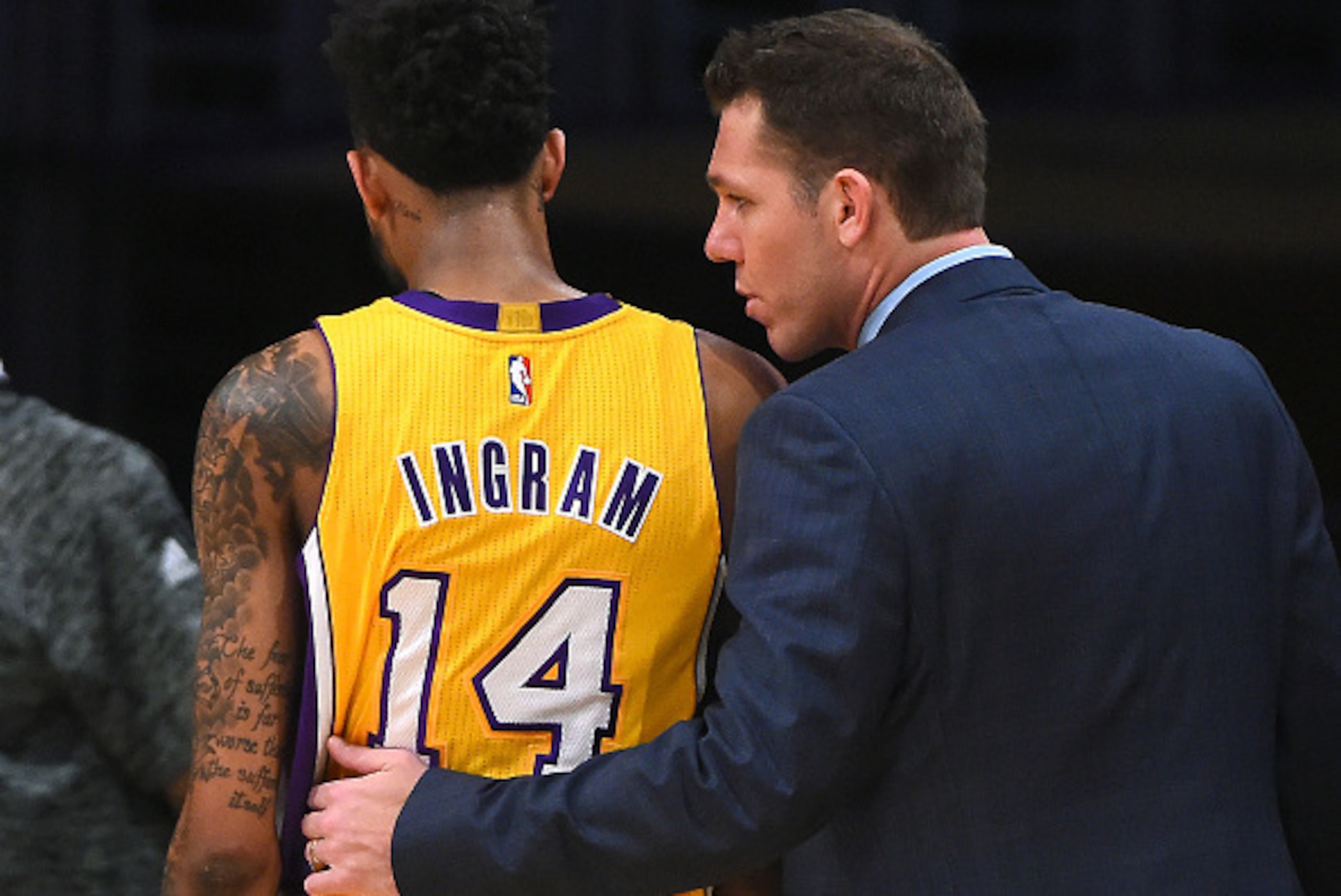 LOS ANGELES, CA - JANUARY 31:  Head coach Luke Walton of the Los Angeles Lakers talks with Brandon Ingram #14 on the bench in the second half of the game against the Denver Nuggets at Staples Center on January 31, 2017 in Los Angeles, California. Lakers w